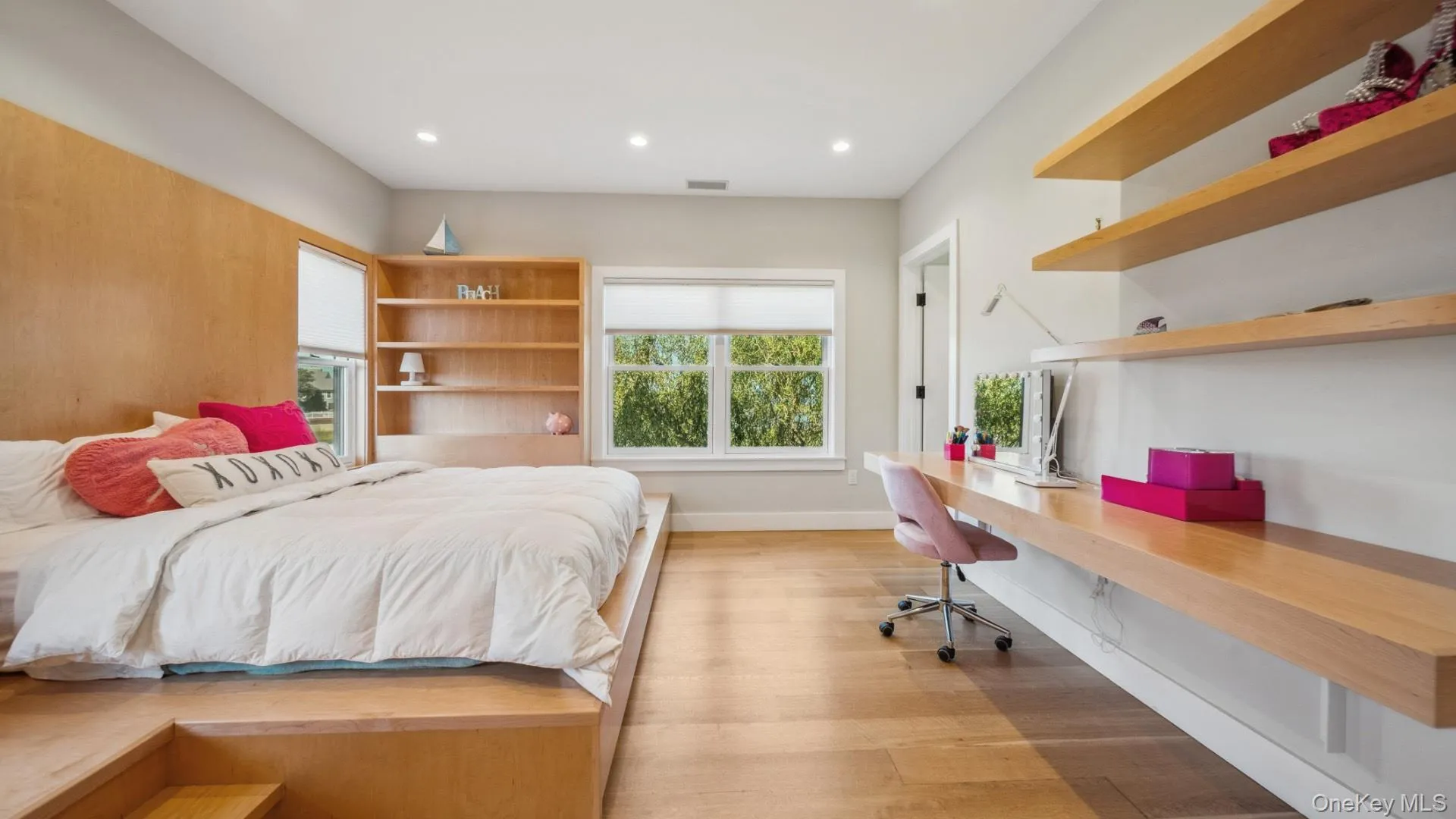 Bedroom with built in study area, light wood-type flooring, and recessed lighting Bedroom with built in study area, light wood-type flooring, and recessed lighting