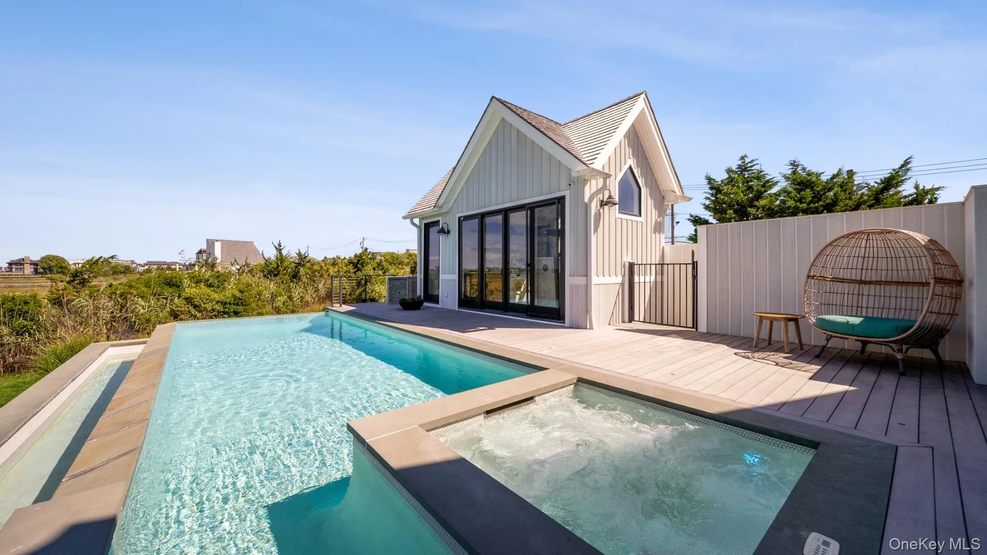 View of swimming pool featuring a roof deck and a pool with connected hot tub View of swimming pool featuring a roof deck and a pool with connected hot tub