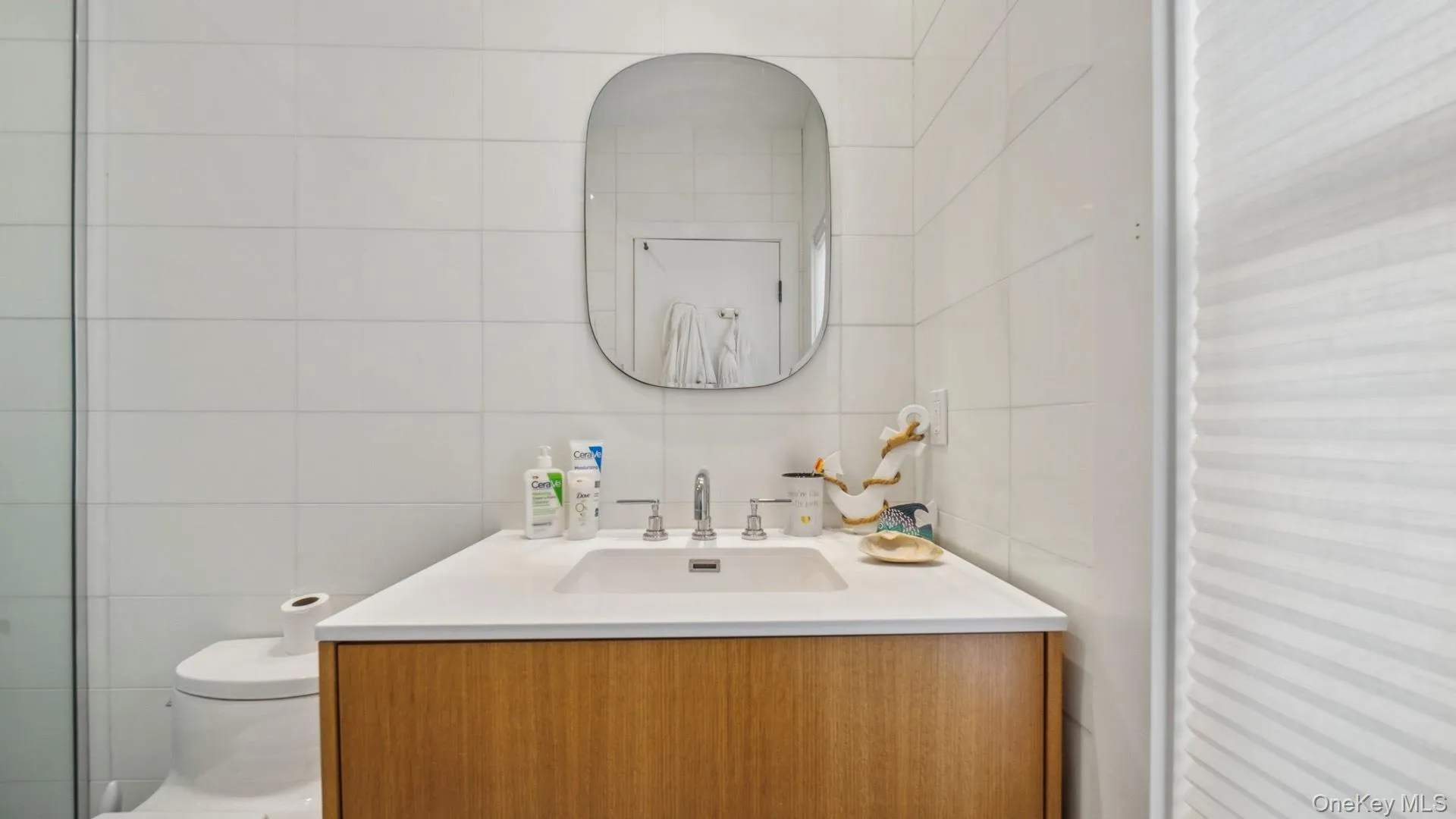 Bathroom with vanity and tile walls Bathroom with vanity and tile walls