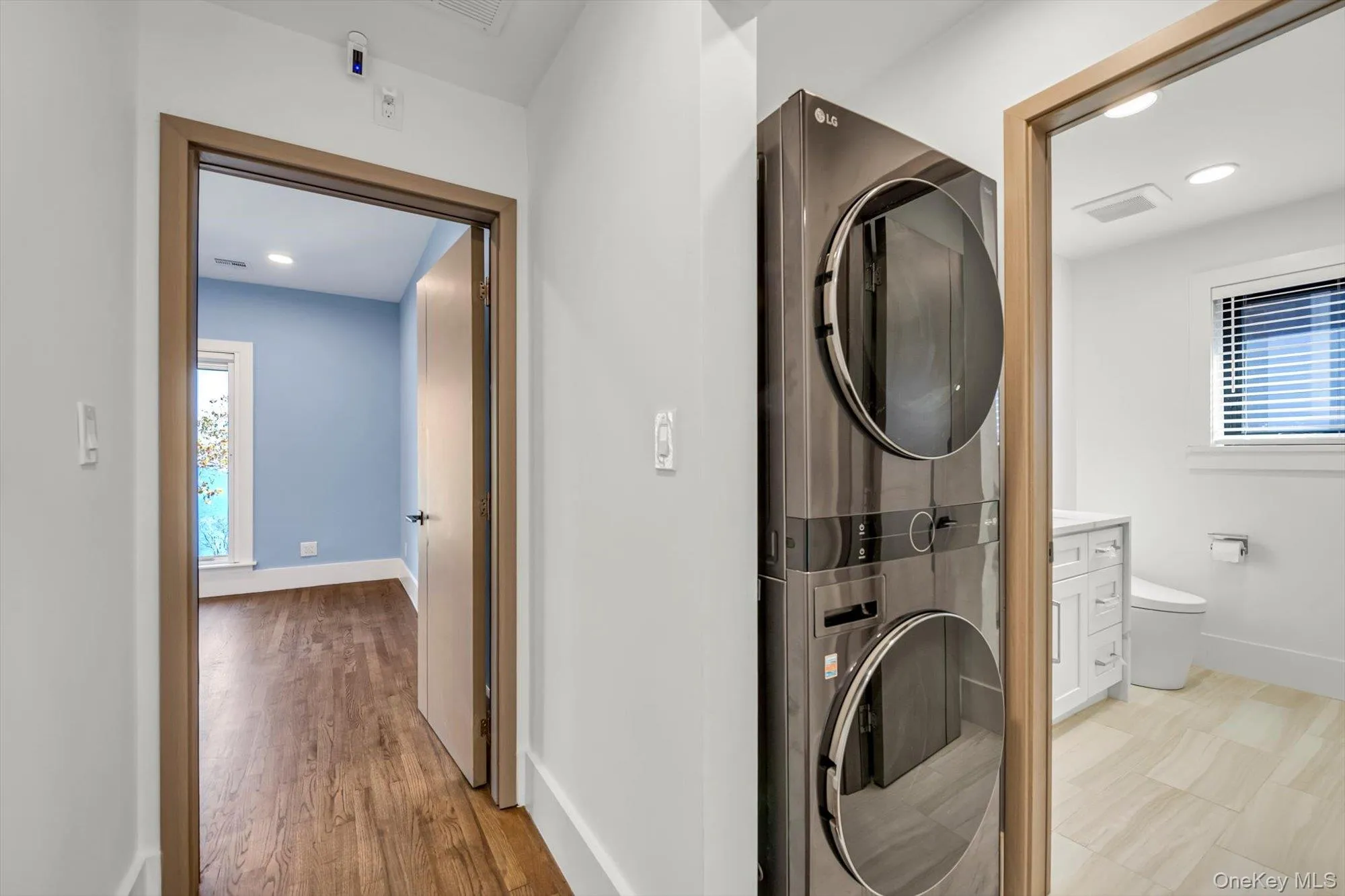 Laundry area featuring recessed lighting and stacked washer / drying machine Laundry area featuring recessed lighting and stacked washer / drying machine