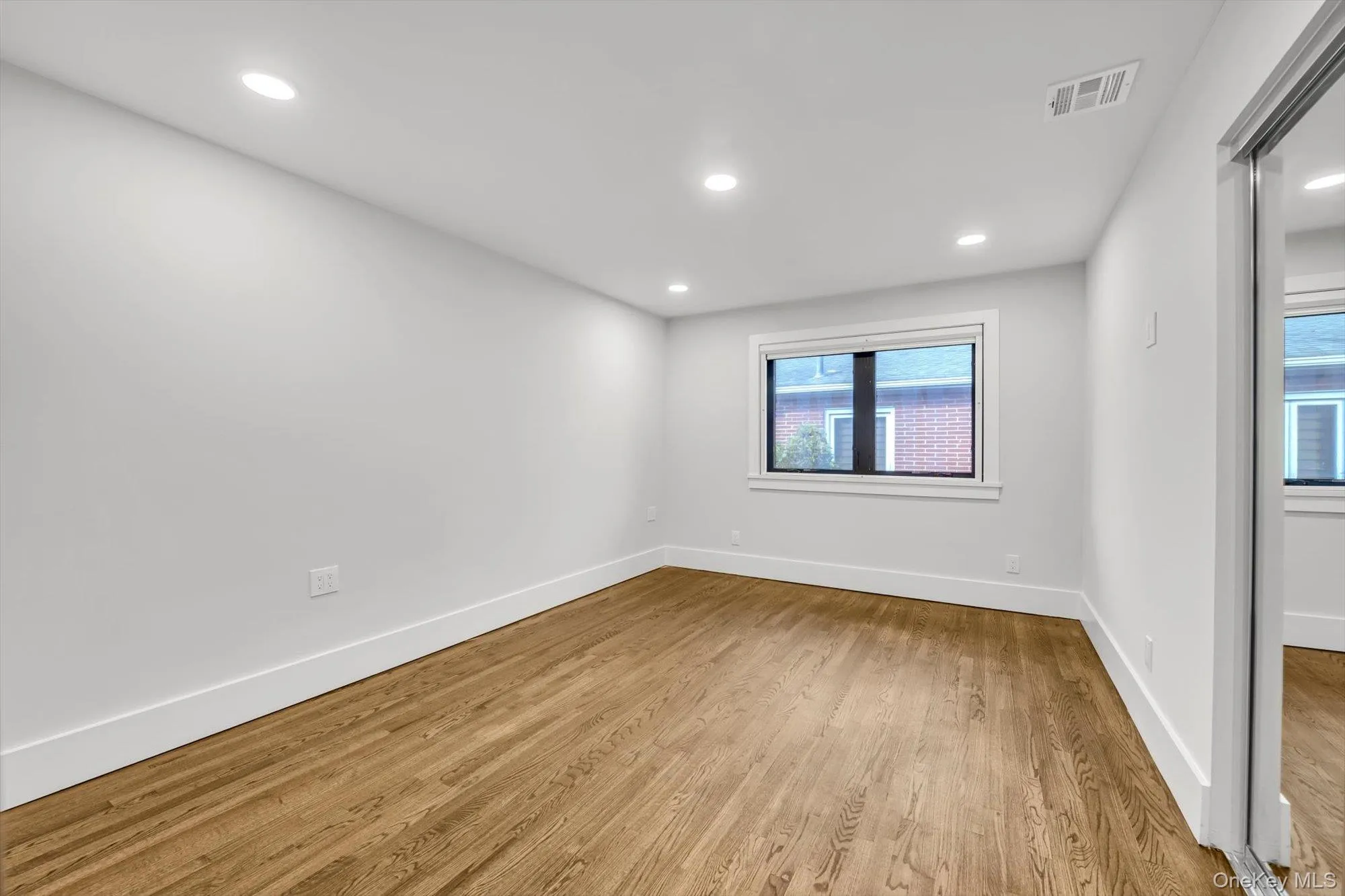 Empty room featuring recessed lighting and light wood-style flooring Empty room featuring recessed lighting and light wood-style flooring