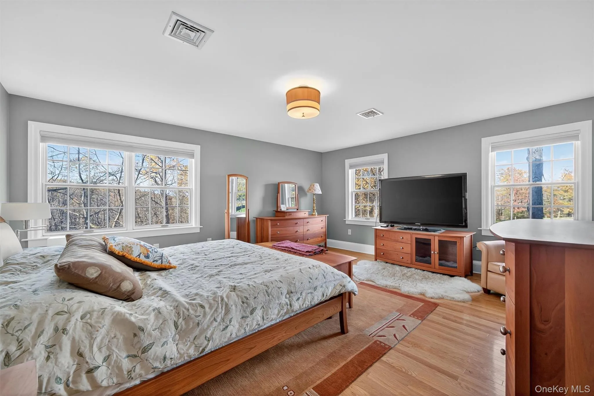 Bedroom with light wood-style floors and baseboards Bedroom with light wood-style floors and baseboards