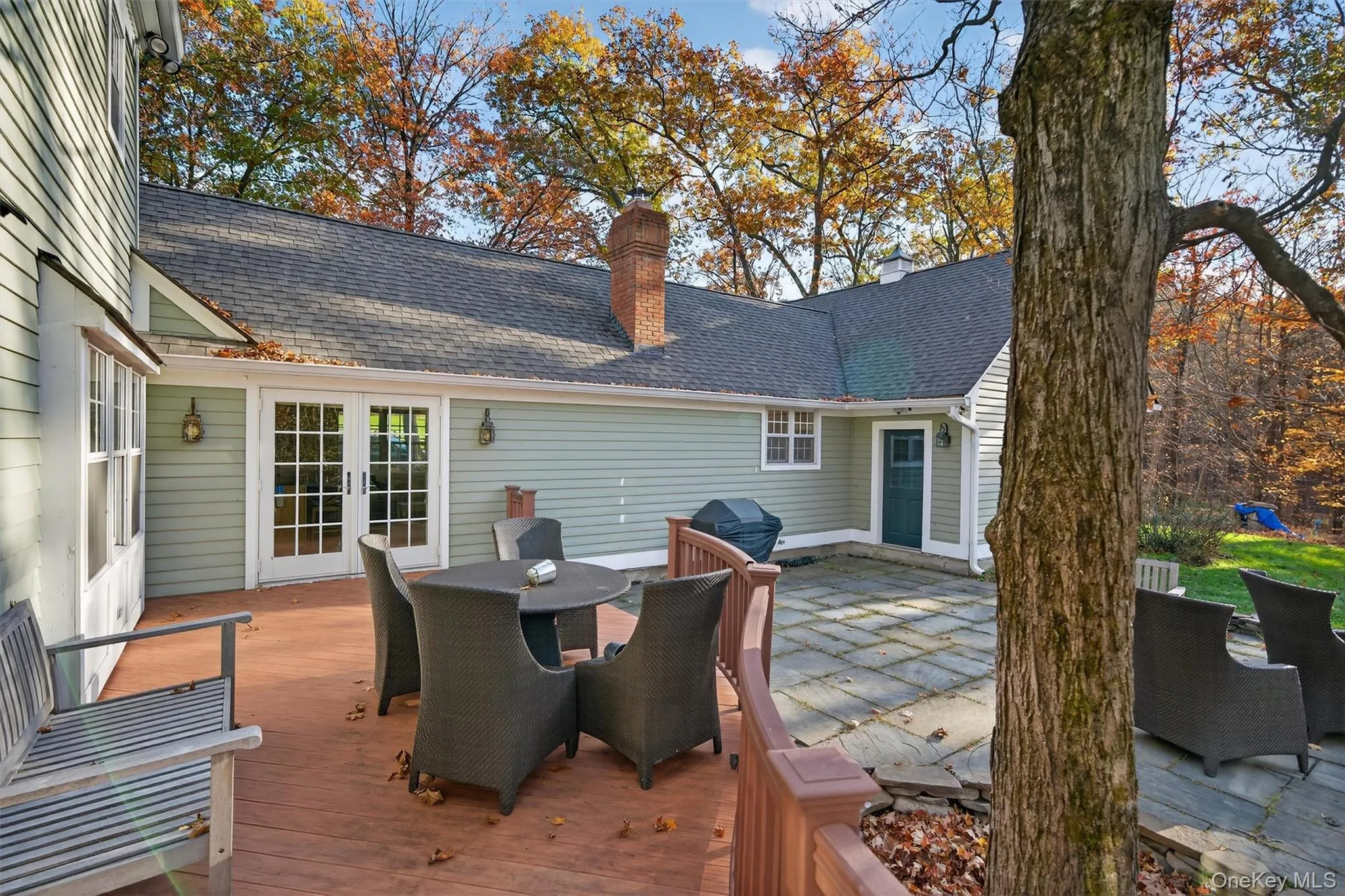 Wooden terrace with outdoor dining space, french doors, a patio, and area for grilling Wooden terrace with outdoor dining space, french doors, a patio, and area for grilling