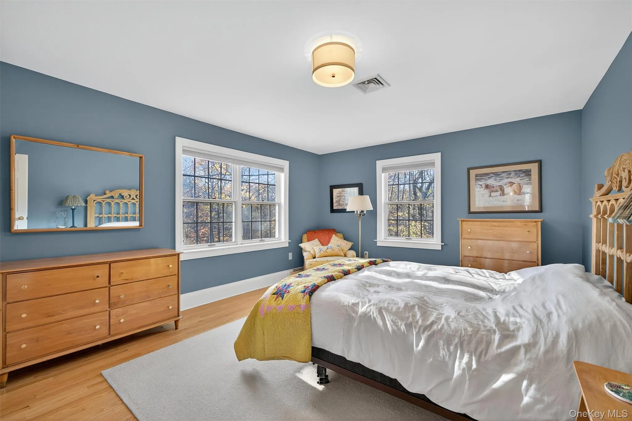 Bedroom with light wood-style floors and baseboards Bedroom with light wood-style floors and baseboards
