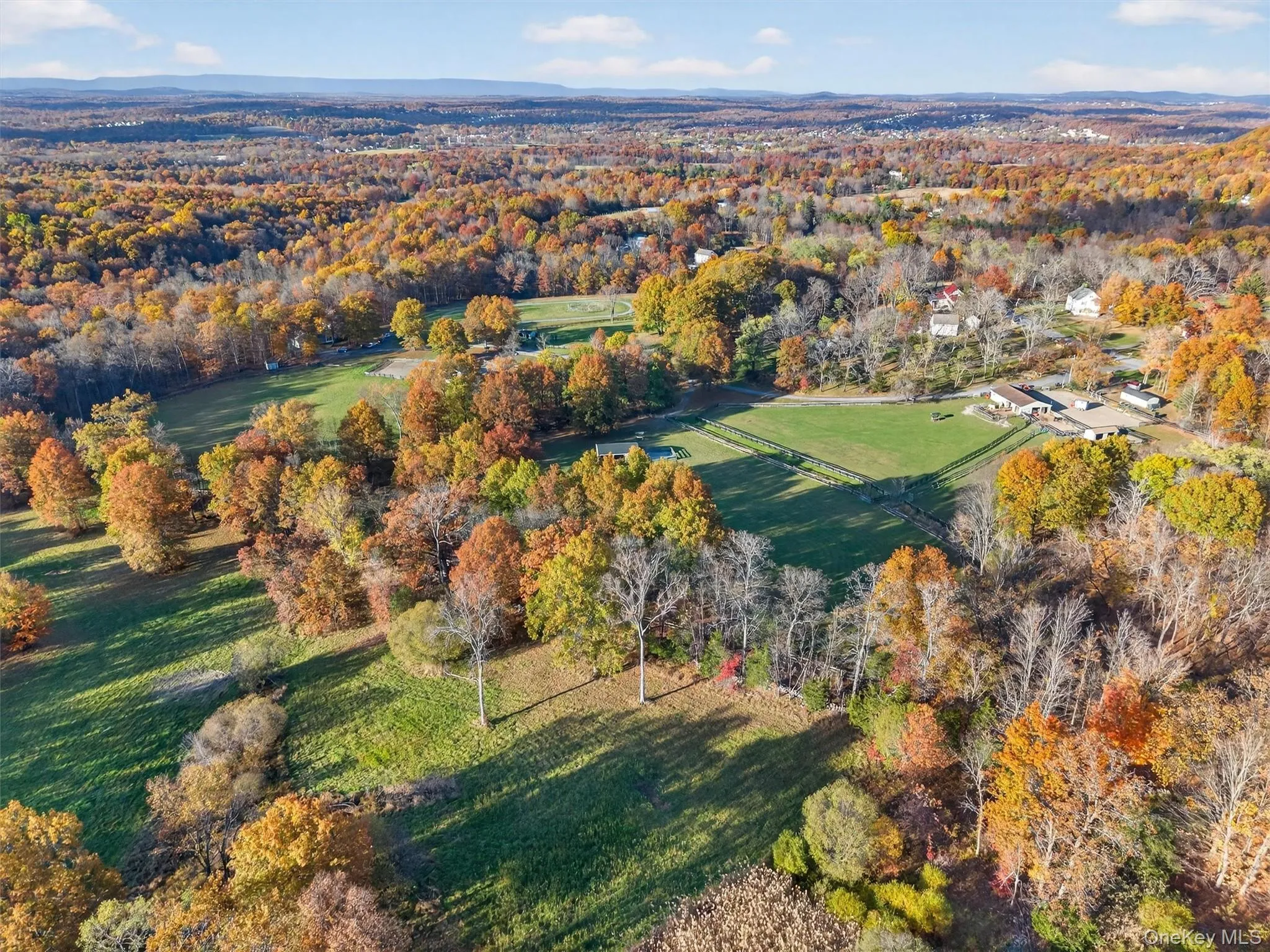 Aerial view of property and surrounding area featuring a forest Aerial view of property and surrounding area featuring a forest