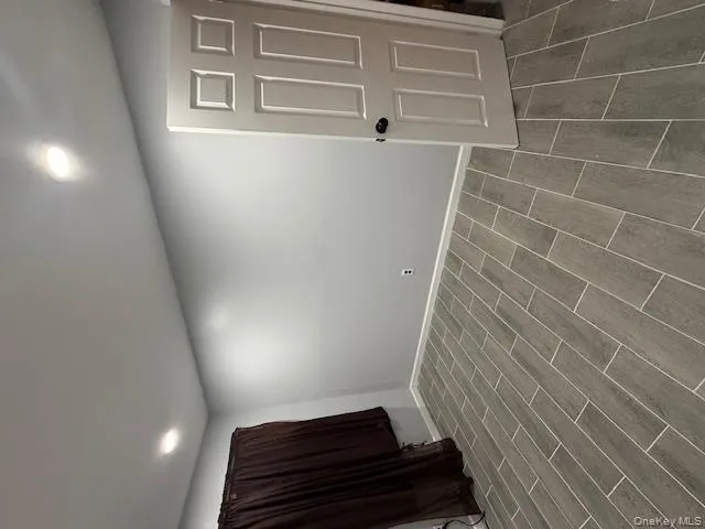 Spare room with wood tiled floors and recessed lighting Spare room with wood tiled floors and recessed lighting