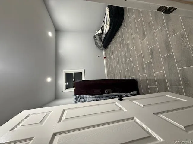 Bedroom featuring wood finish floors and recessed lighting Bedroom featuring wood finish floors and recessed lighting