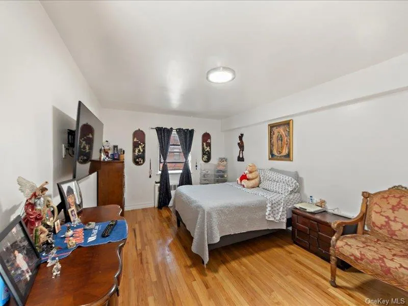 Bedroom with light wood-style flooring Bedroom with light wood-style flooring