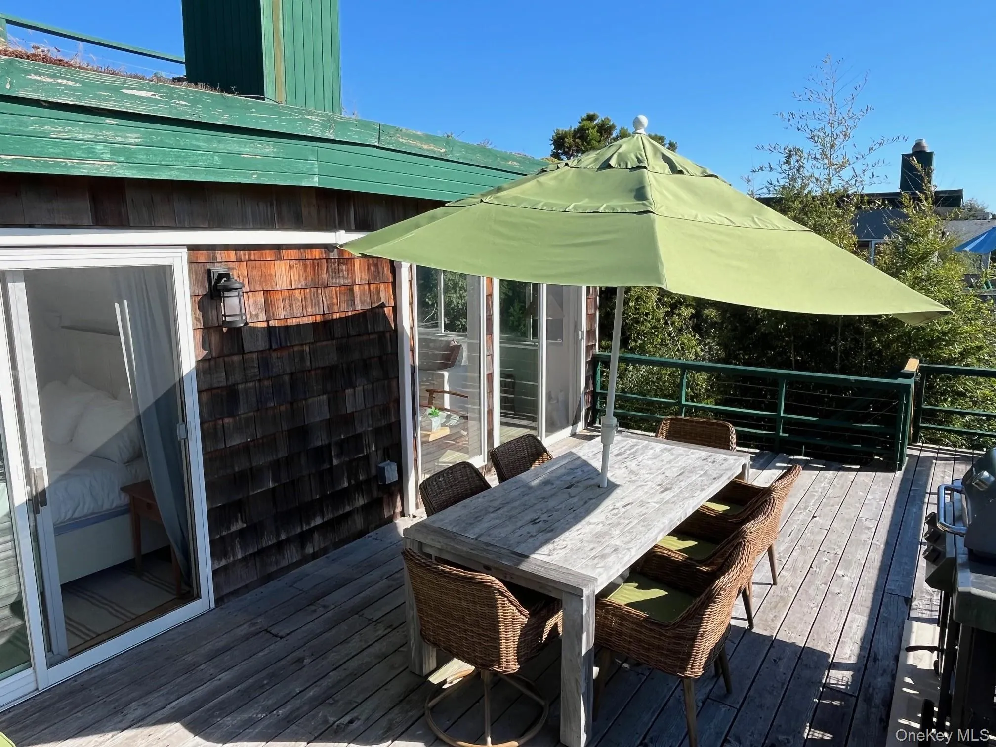 Deck with outdoor dining area and a grill Deck with outdoor dining area and a grill