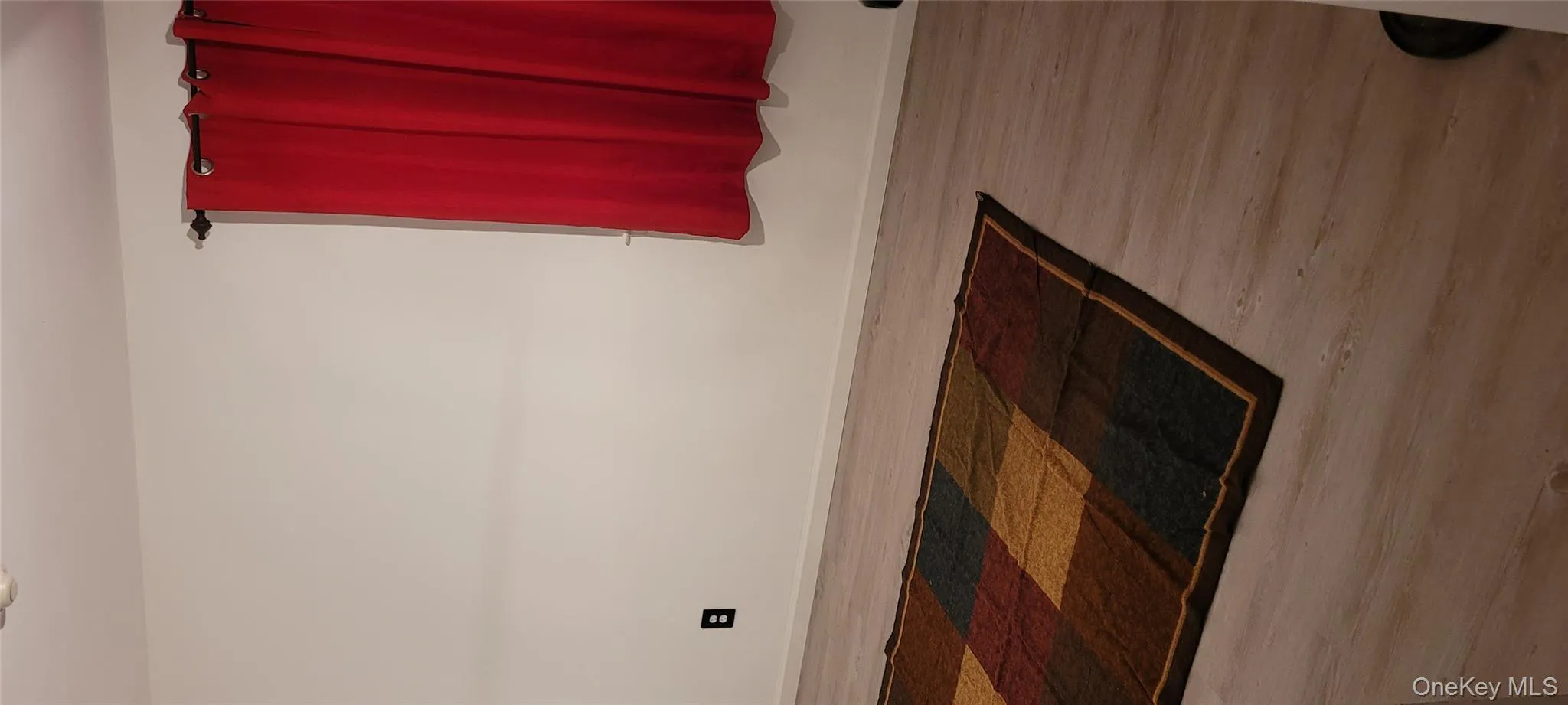 Spare room with wood finished floors and baseboards Spare room with wood finished floors and baseboards