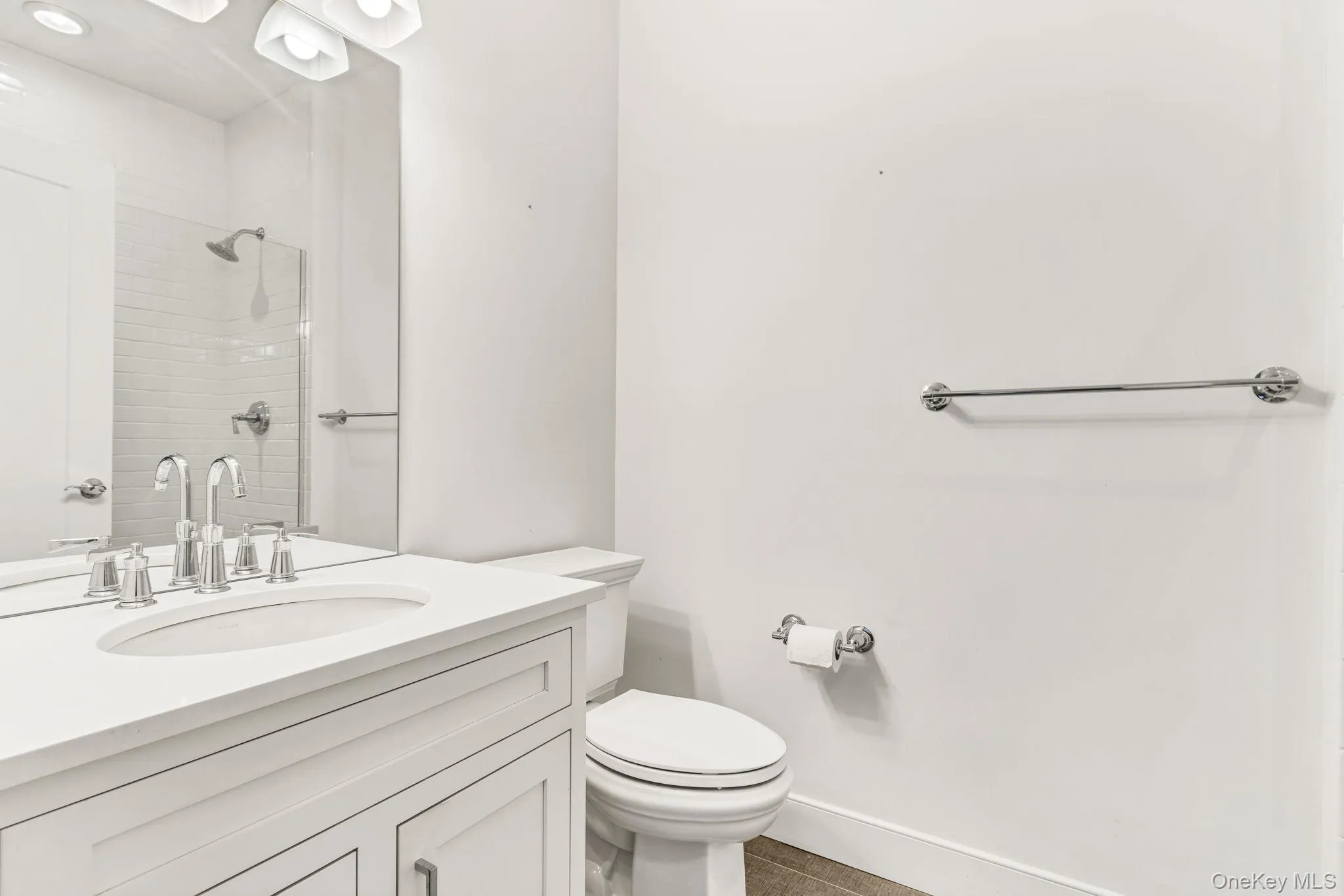 Bathroom featuring vanity and a tile shower Bathroom featuring vanity and a tile shower