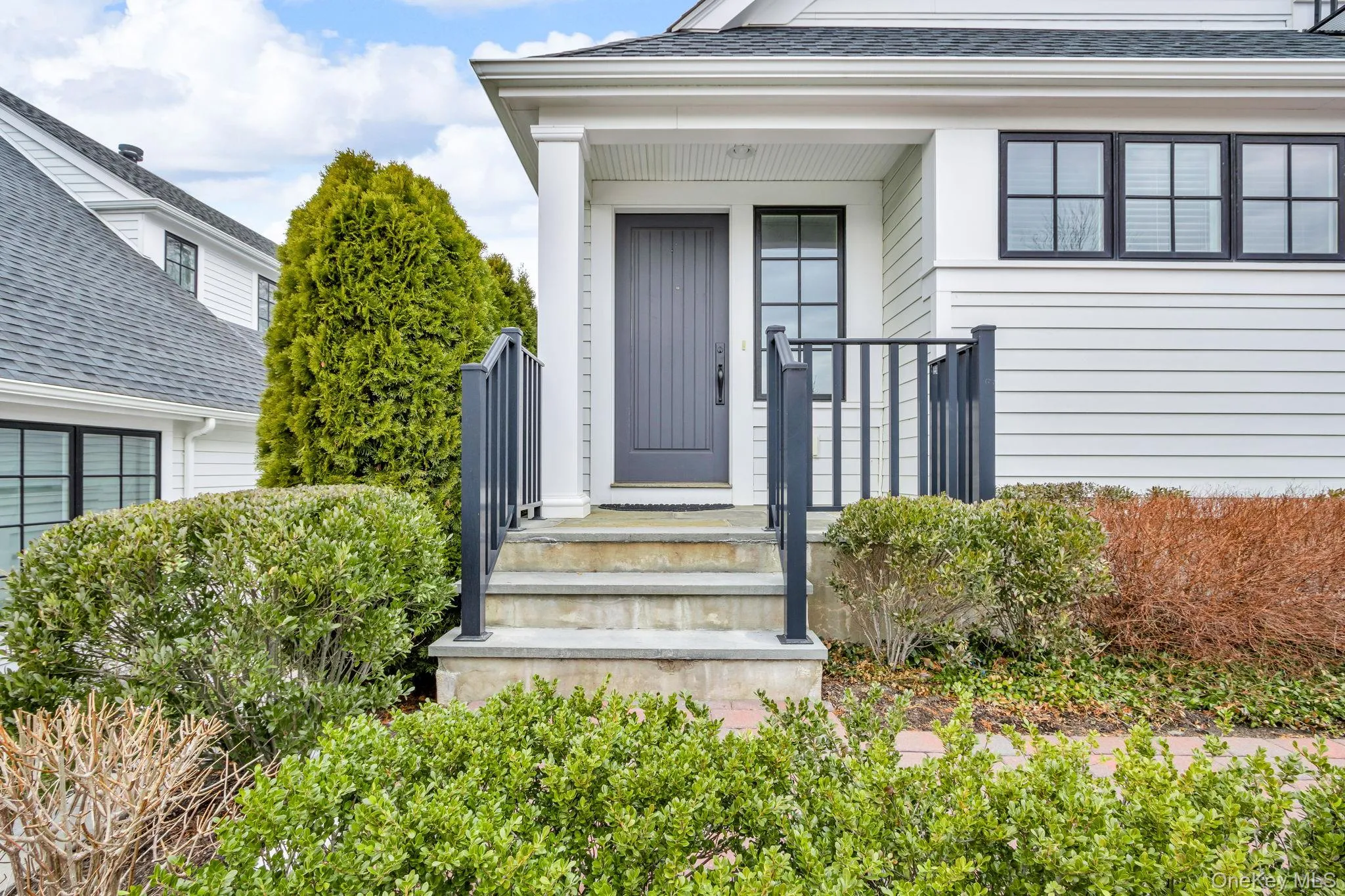 Doorway to property featuring roof with shingles Doorway to property featuring roof with shingles