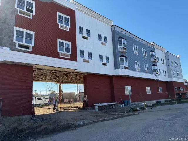View of building exterior with parking lot entrance View of building exterior with parking lot entrance