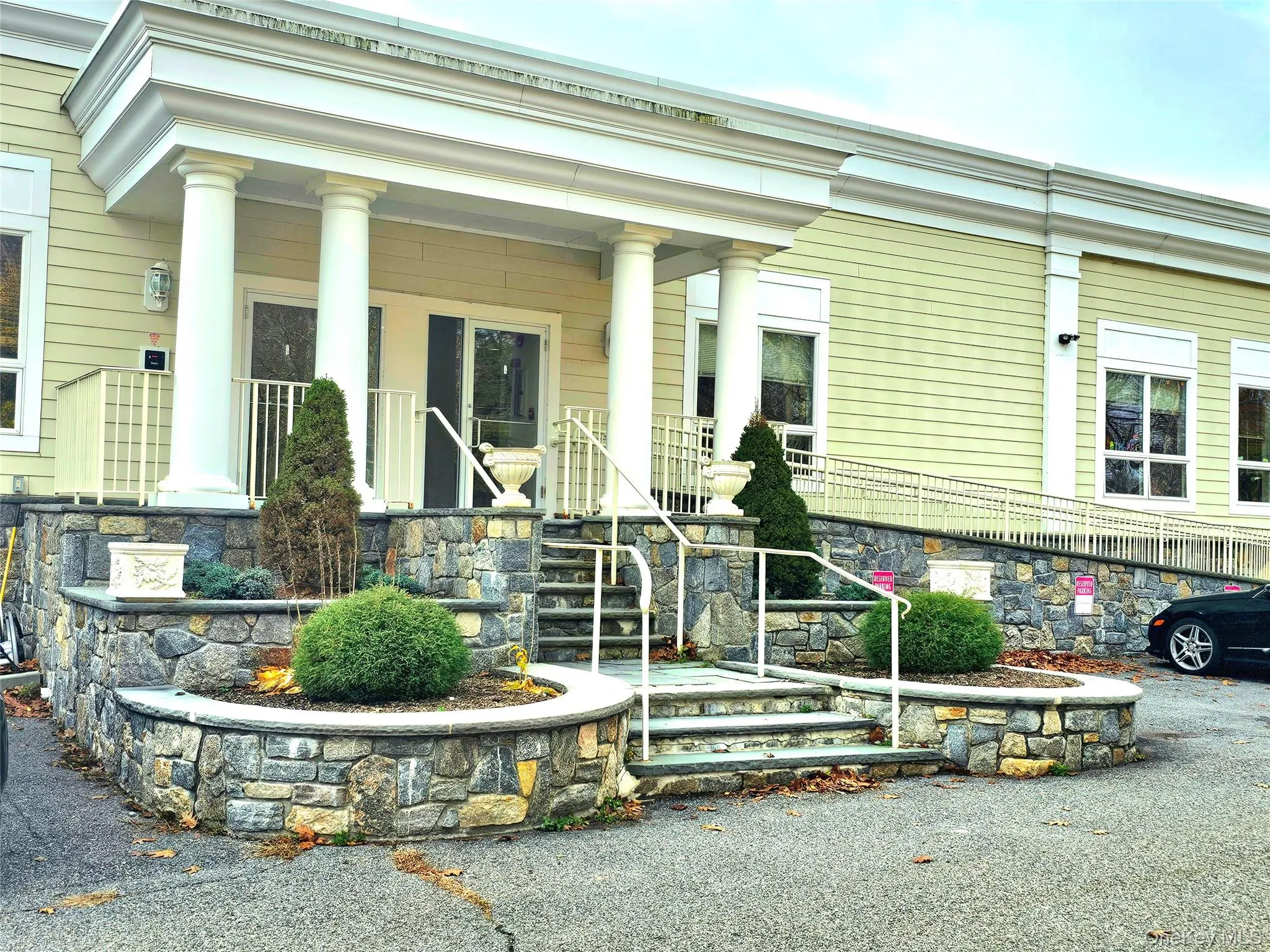 View of exterior entry featuring a porch and stone siding View of exterior entry featuring a porch and stone siding