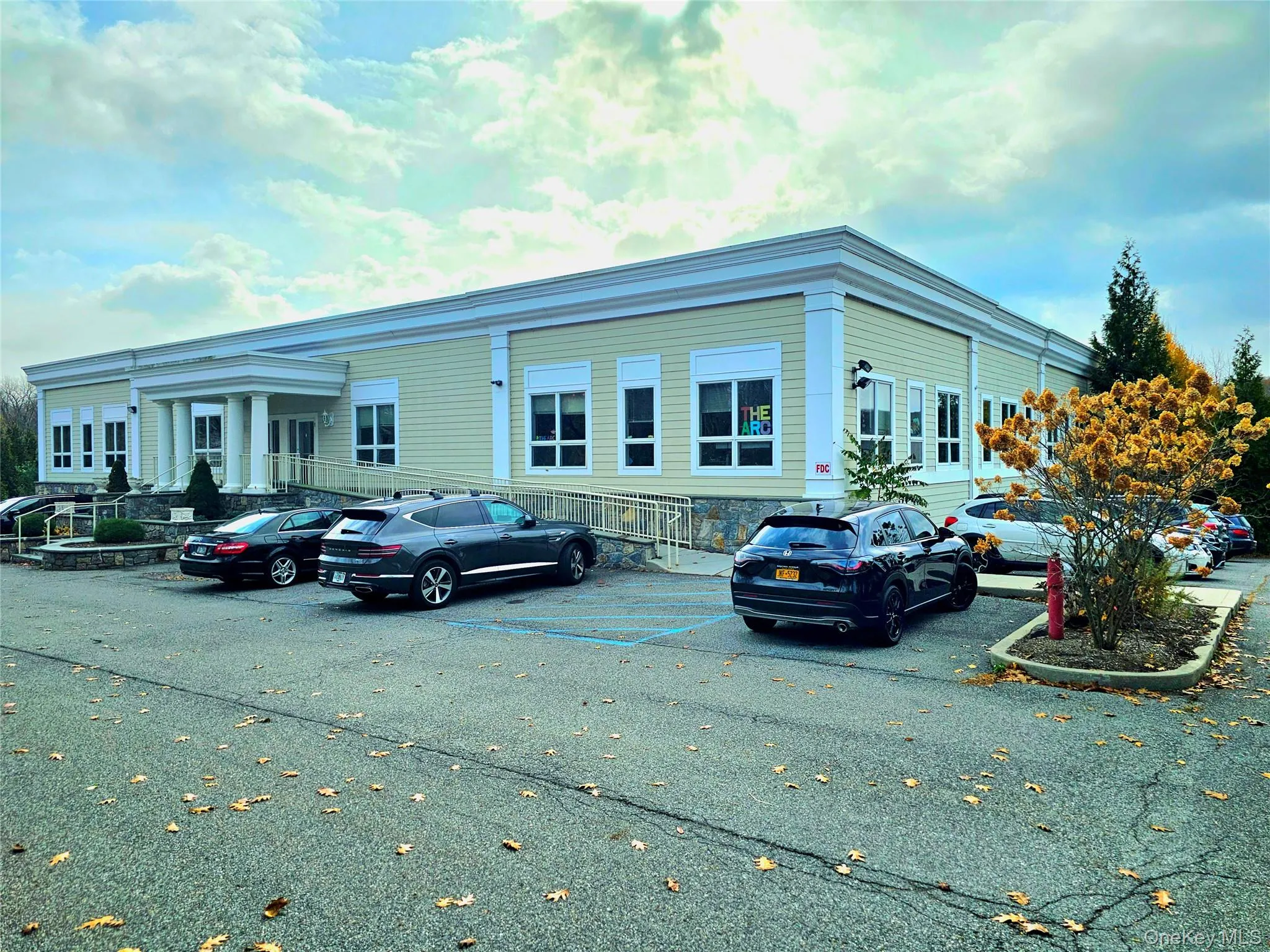 View of building exterior with uncovered parking View of building exterior with uncovered parking