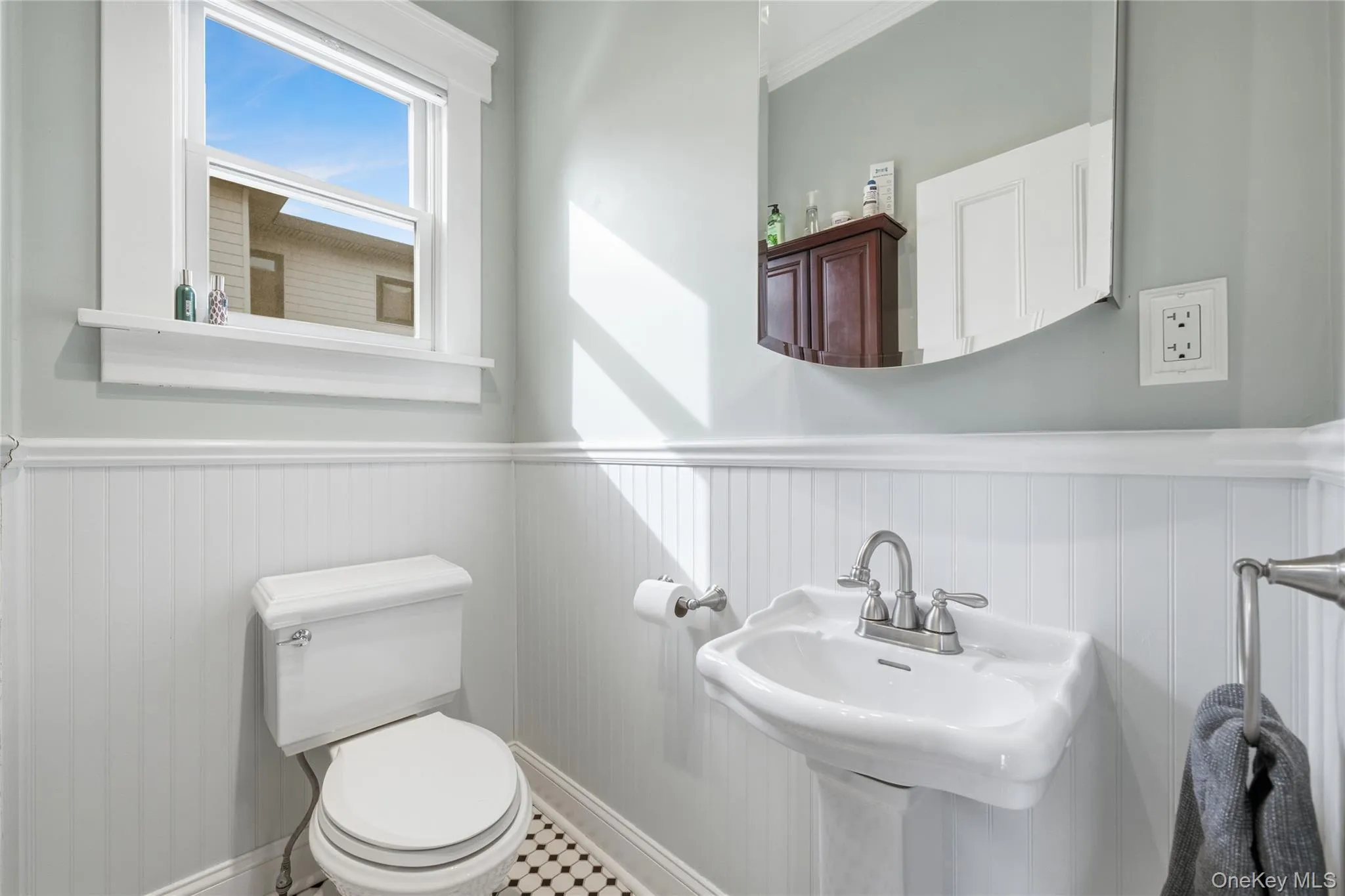Half bathroom with toilet and wainscoting Half bathroom with toilet and wainscoting