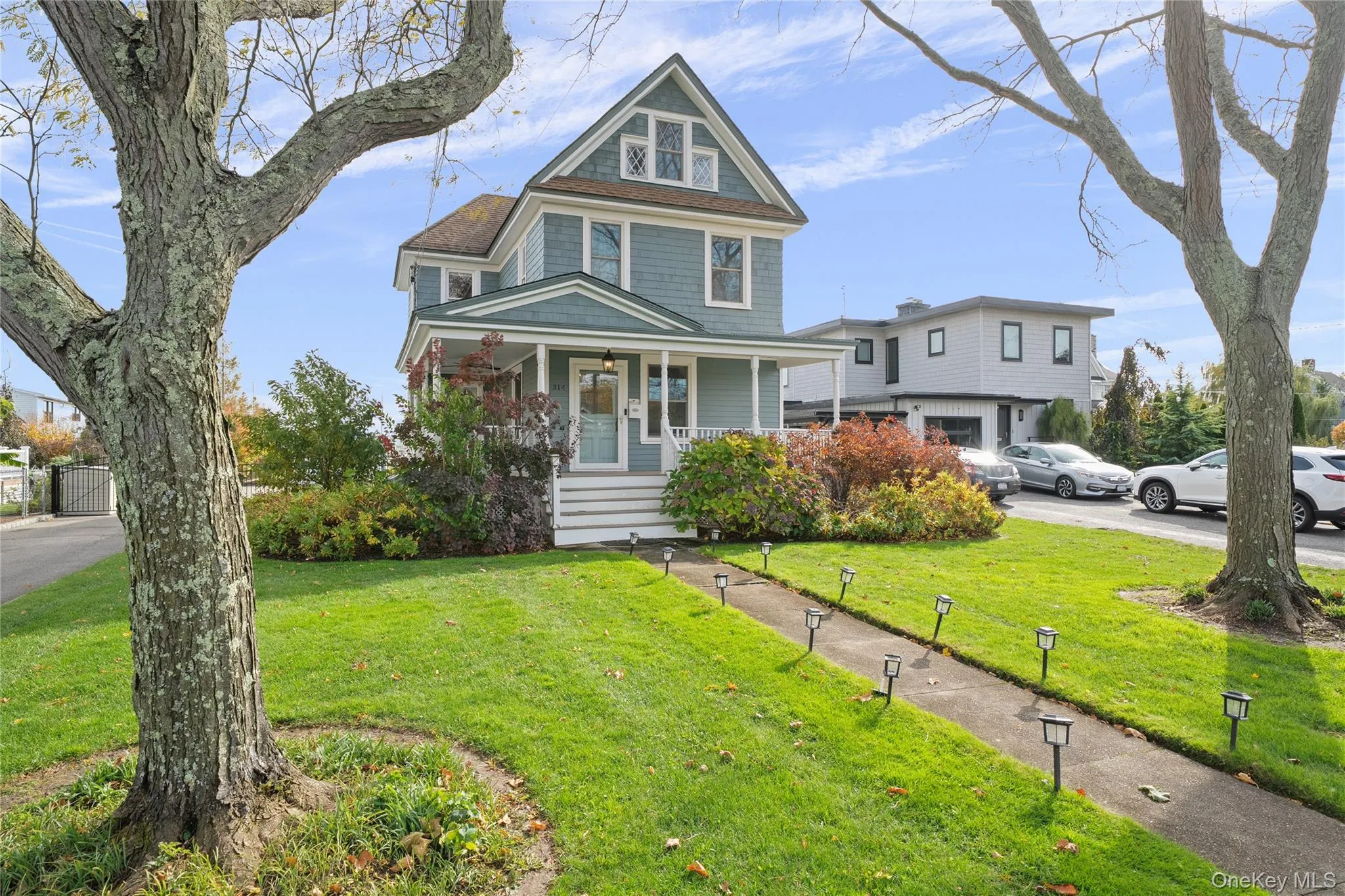 View of front of home with a porch and a front yard View of front of home with a porch and a front yard