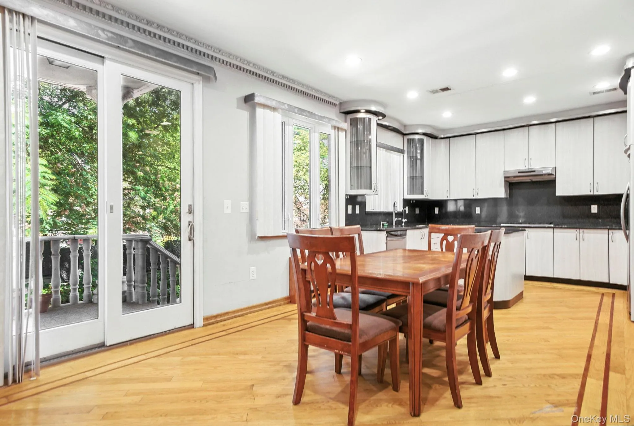 Dining area featuring light wood-style floors and recessed lighting Dining area featuring light wood-style floors and recessed lighting
