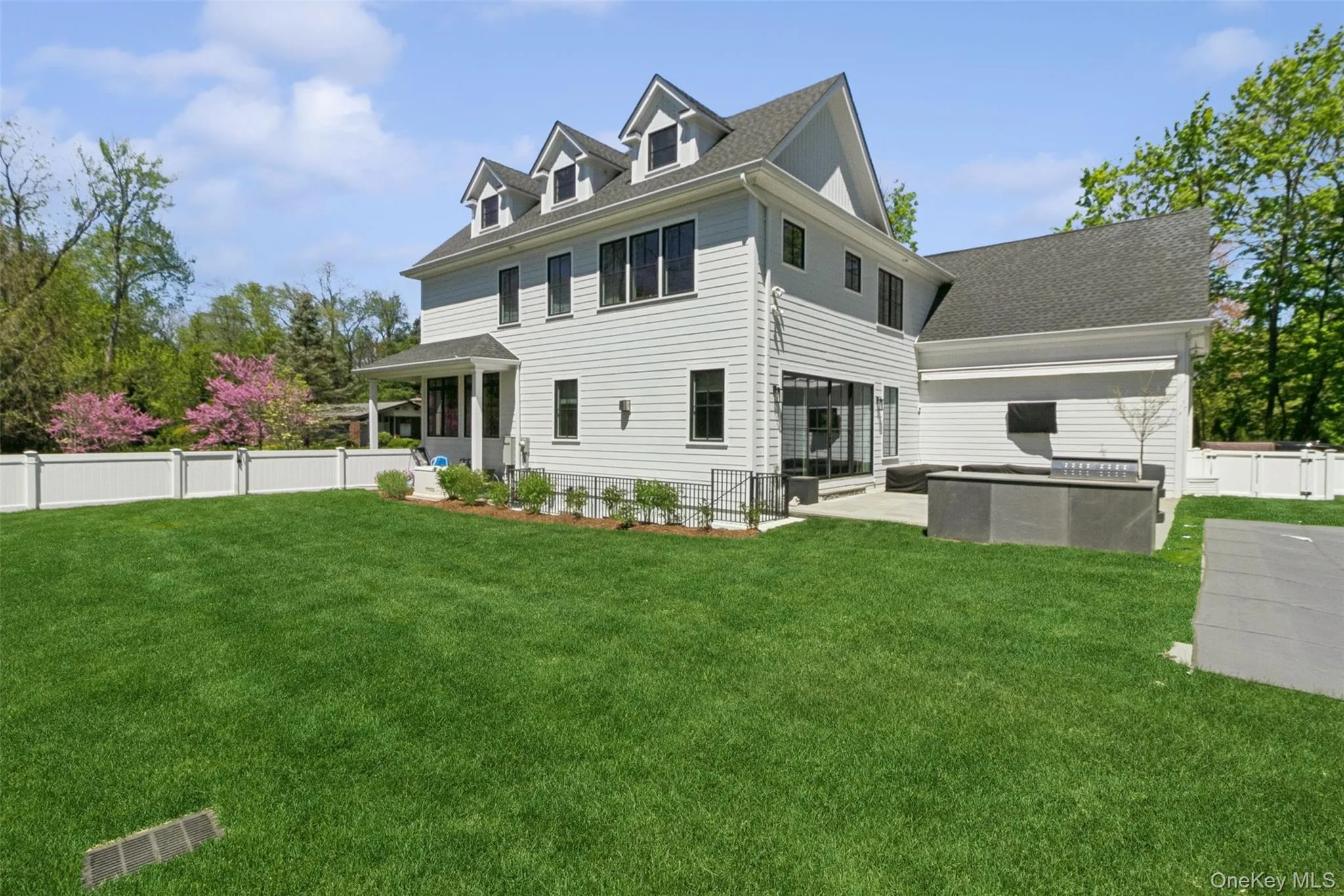 side view of backyard, a patio side view of backyard, a patio