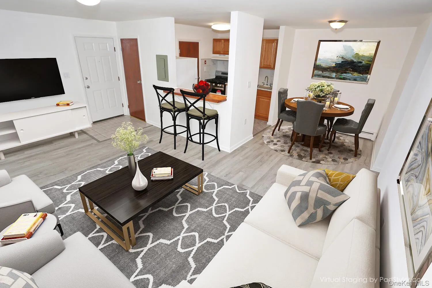 Living room featuring light wood-type flooring and baseboards Living room featuring light wood-type flooring and baseboards