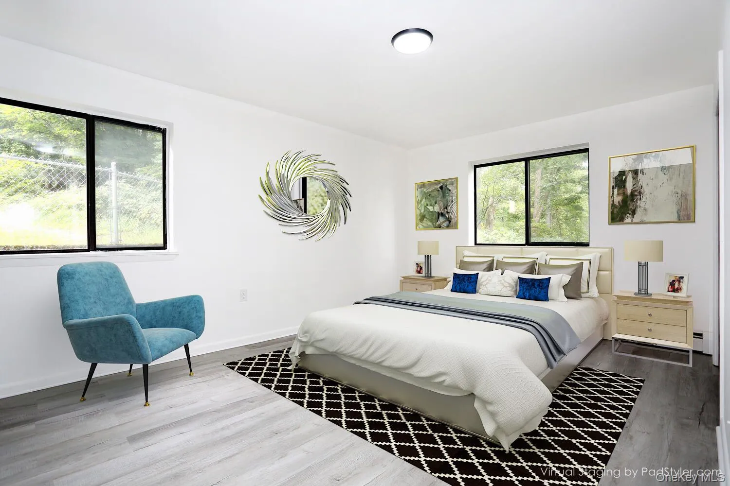Bedroom featuring wood finished floors and baseboards Bedroom featuring wood finished floors and baseboards