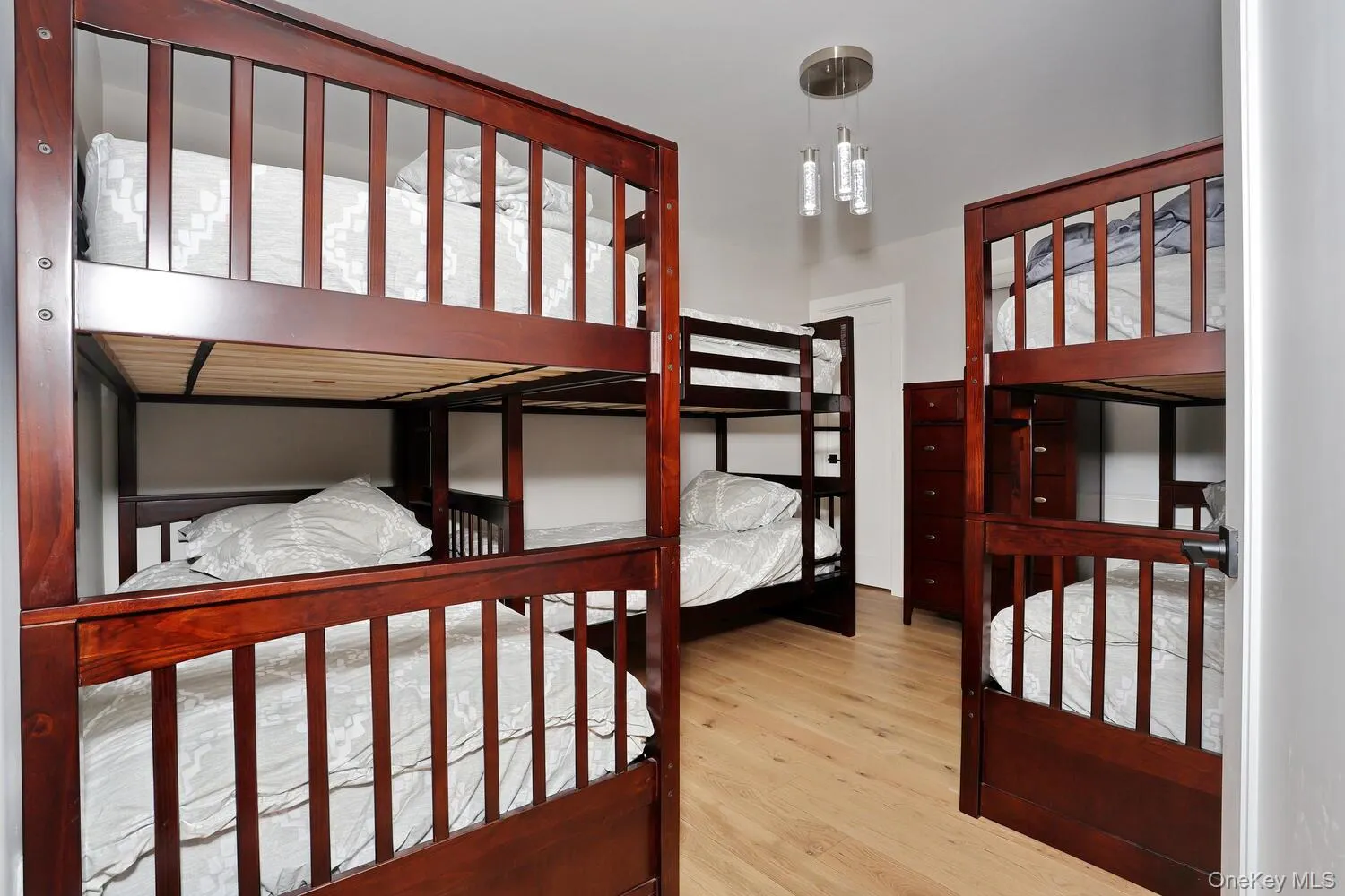 Bedroom featuring light wood finished floors Bedroom featuring light wood finished floors