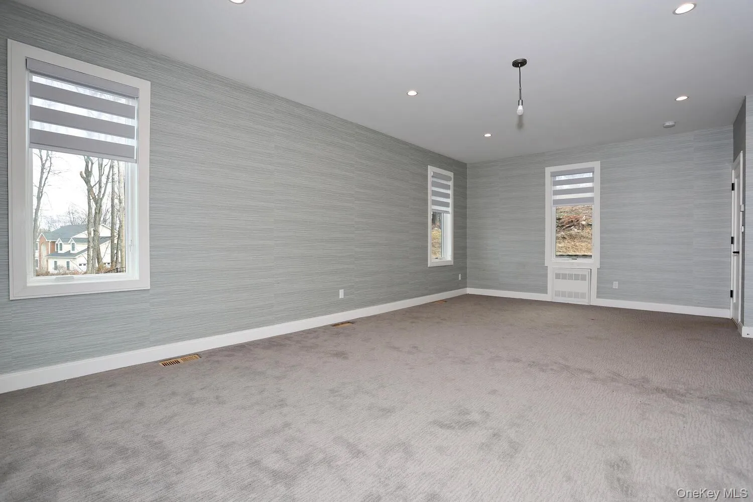 Spare room featuring carpet and recessed lighting Spare room featuring carpet and recessed lighting
