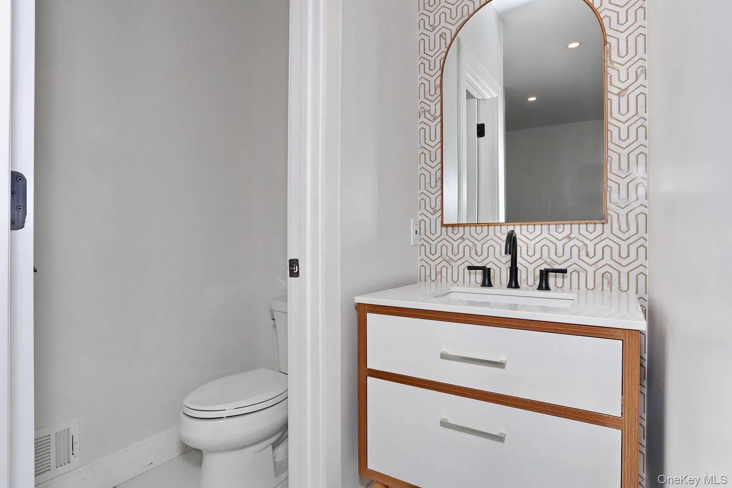 Bathroom with vanity and tasteful backsplash Bathroom with vanity and tasteful backsplash