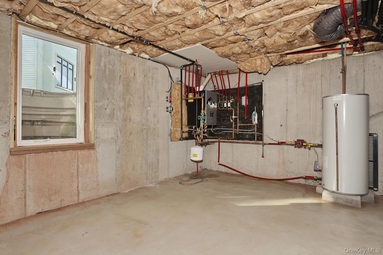 Utility room featuring gas water heater Utility room featuring gas water heater
