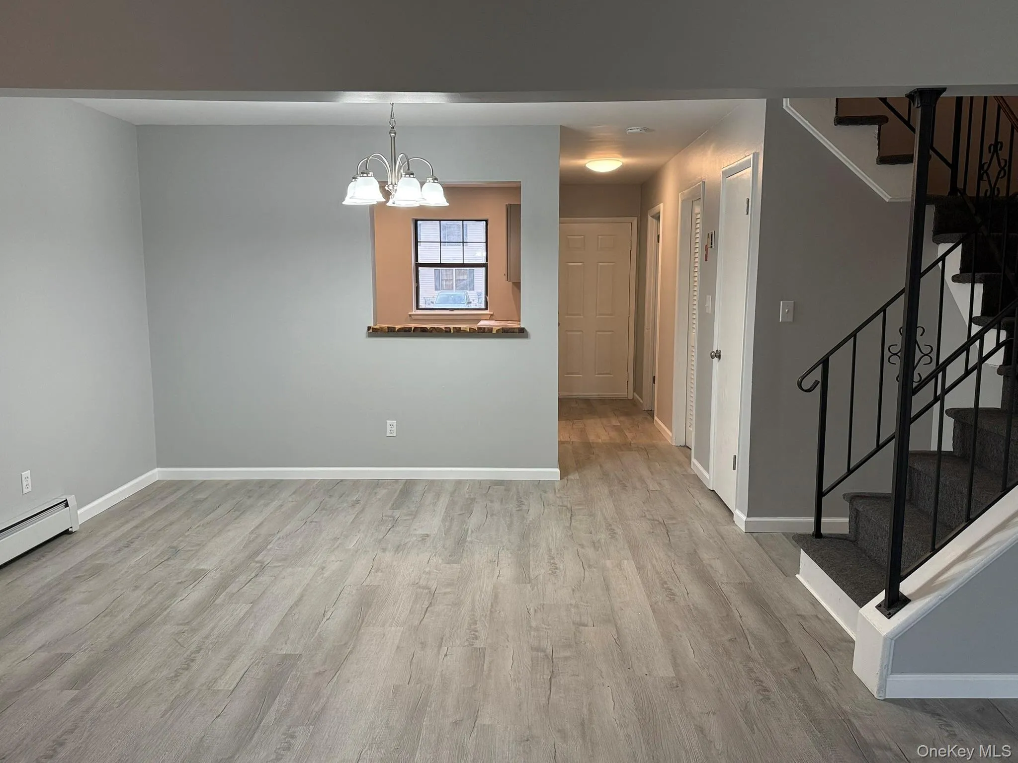 Living room looking into the dining room, kitchen and entrance foyer Living room looking into the dining room, kitchen and entrance foyer