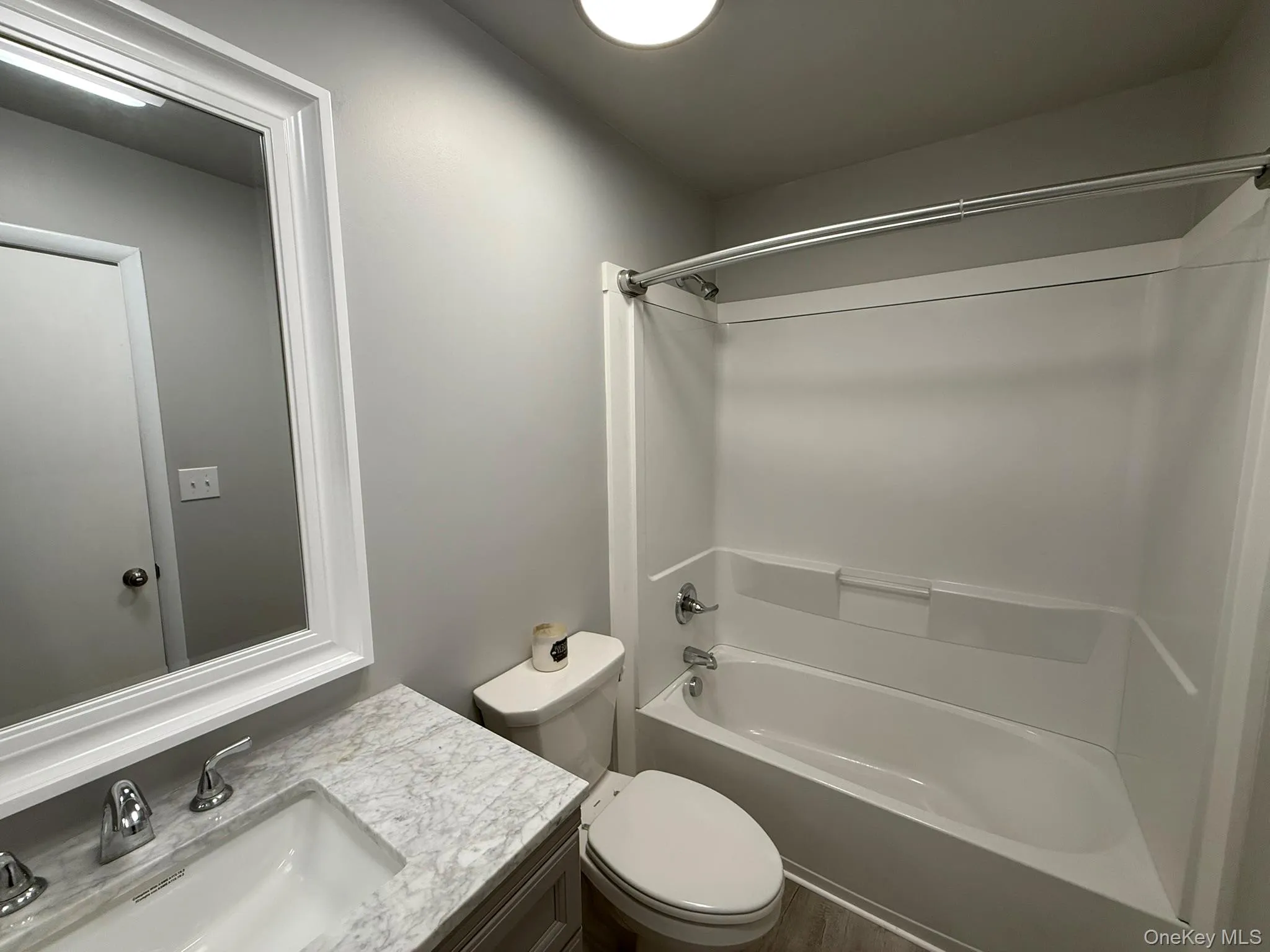 Bathroom featuring shower / bath combination and vanity Bathroom featuring shower / bath combination and vanity