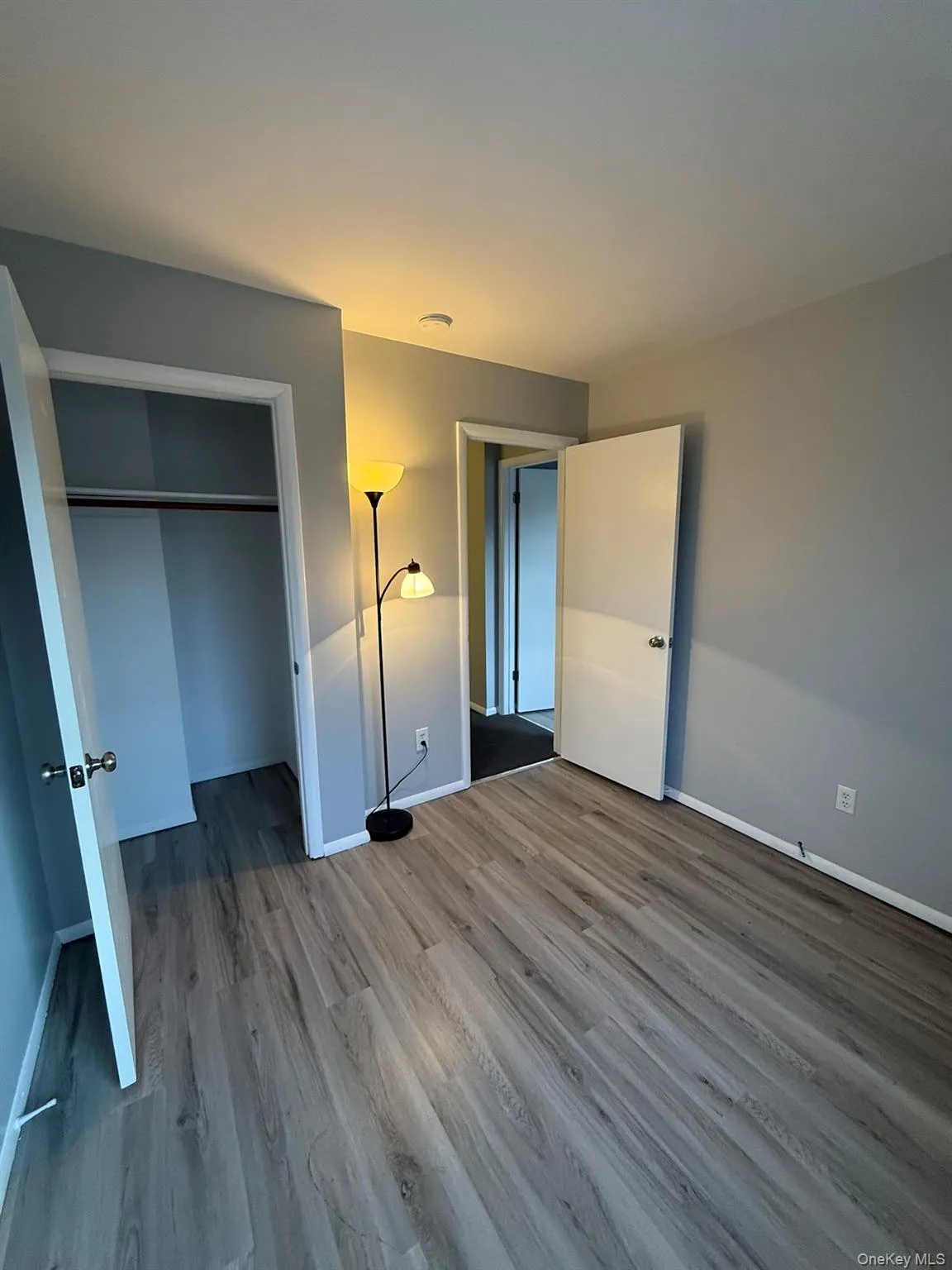 Bedroom #2 featuring wood finished floors and a closet Bedroom #2 featuring wood finished floors and a closet