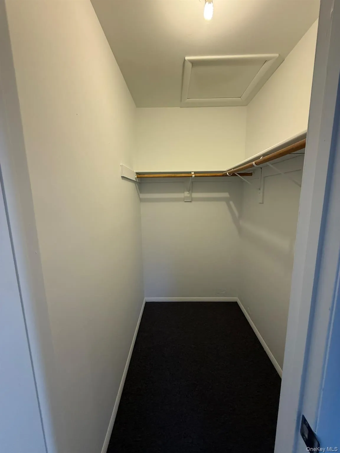 Primary bedroom walk-in closet Primary bedroom walk-in closet