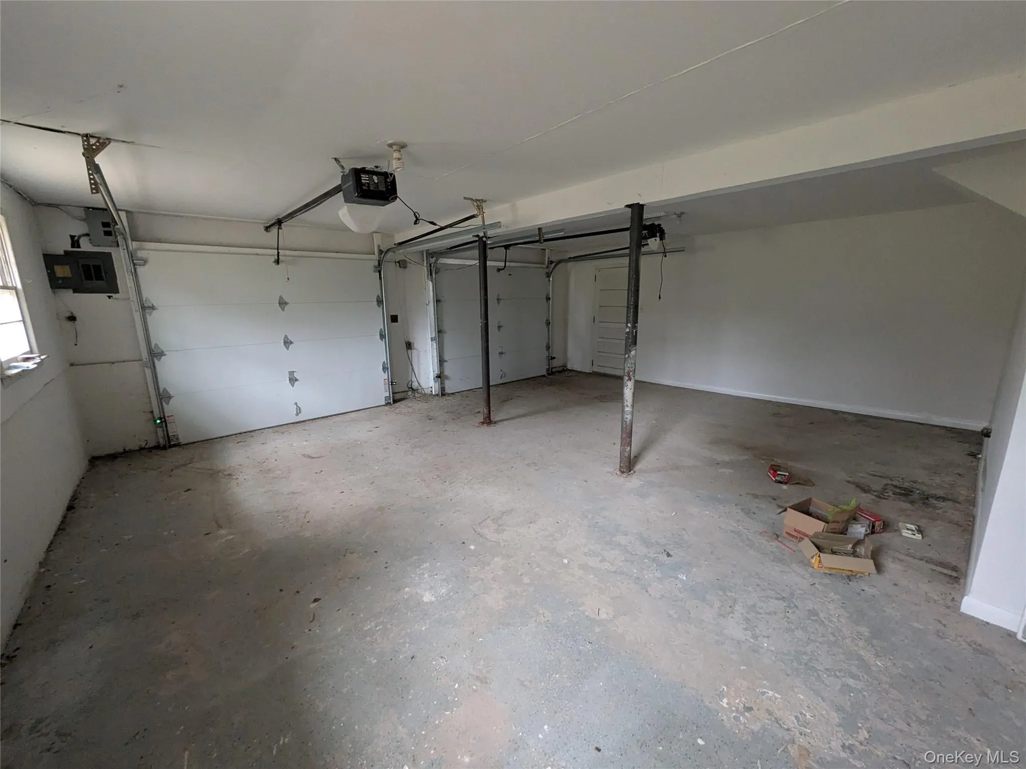 2 Car Garage with a garage door openers on wall. 2 Car Garage with a garage door openers on wall.