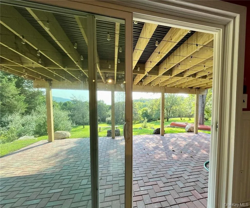 Slider leading to brick patio from lower level Slider leading to brick patio from lower level
