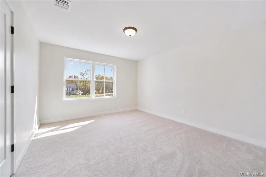 View of carpeted empty room View of carpeted empty room