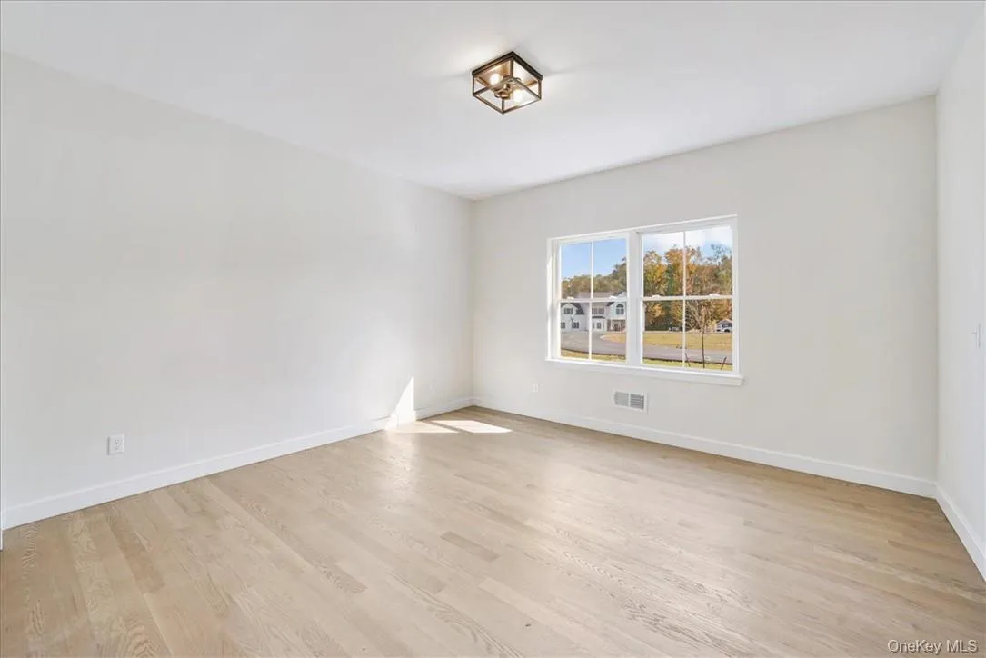 Empty room with light wood-type flooring Empty room with light wood-type flooring