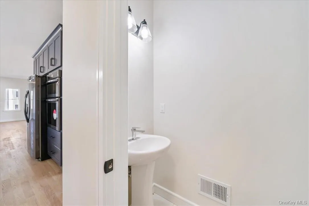 Bathroom with hardwood / wood-style floors Bathroom with hardwood / wood-style floors