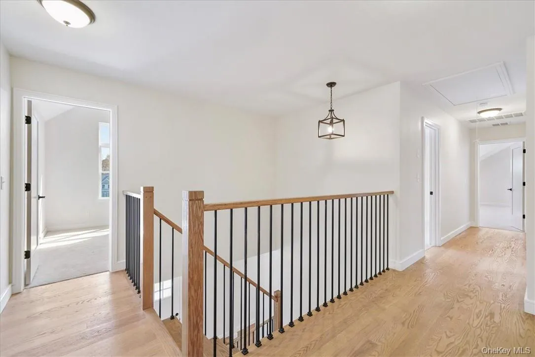 Hall with light hardwood / wood-style flooring Hall with light hardwood / wood-style flooring