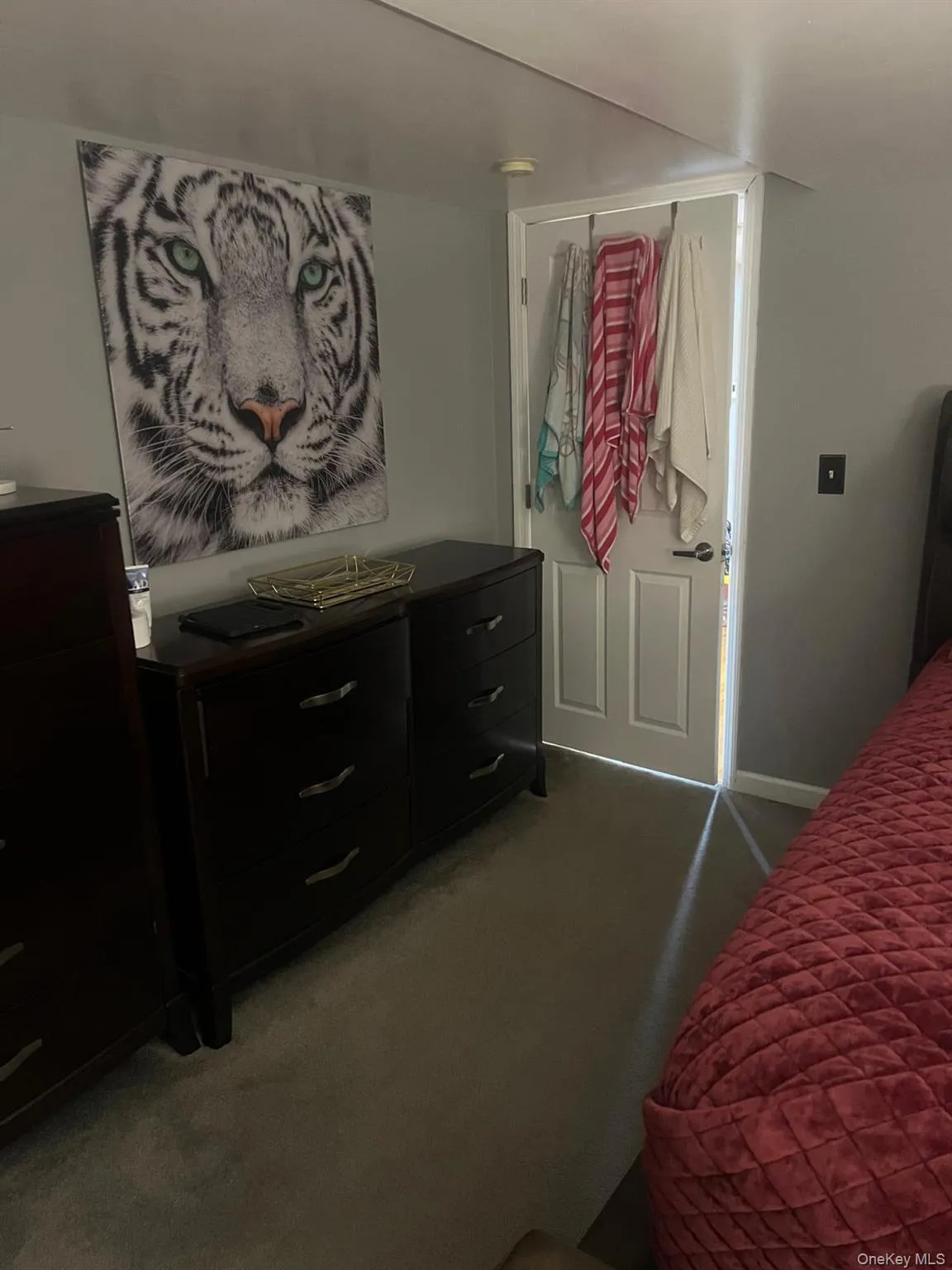 Bedroom with light colored carpet and baseboards Bedroom with light colored carpet and baseboards