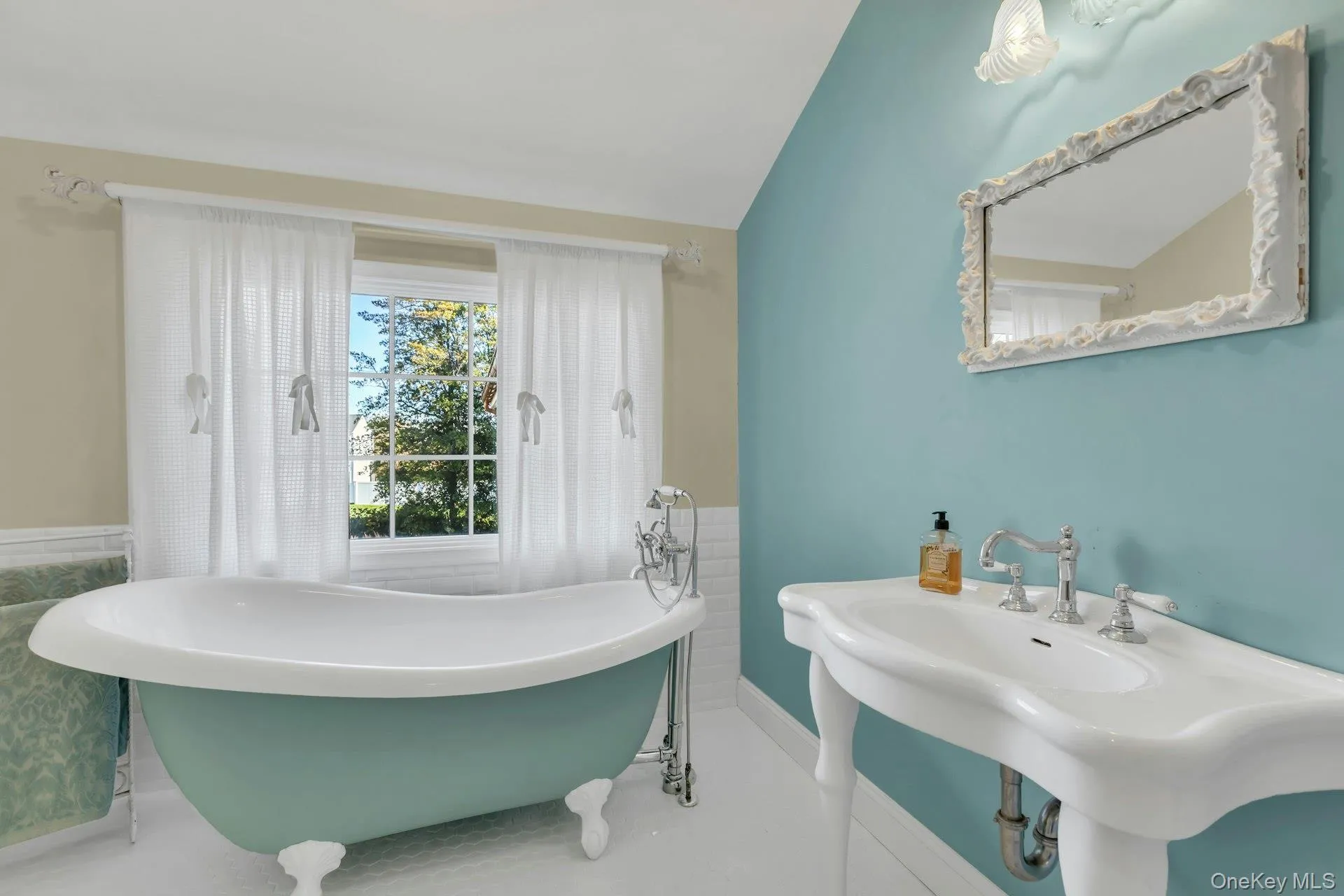 Full bath with a freestanding champaigne soaker bath and vaulted ceiling Full bath with a freestanding champaigne soaker bath and vaulted ceiling