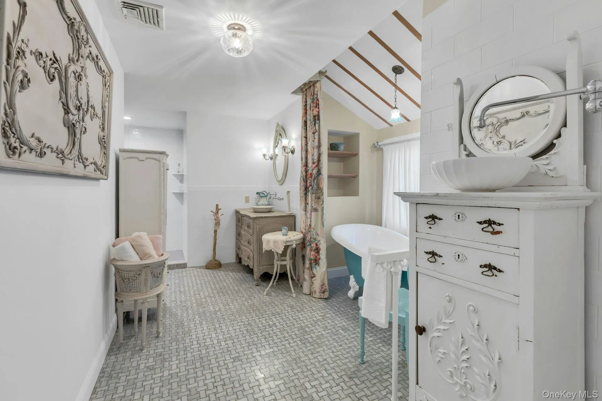 Staged Bathroom with lofted ceiling, a stall shower, vanity, and a soaking tub Staged Bathroom with lofted ceiling, a stall shower, vanity, and a soaking tub