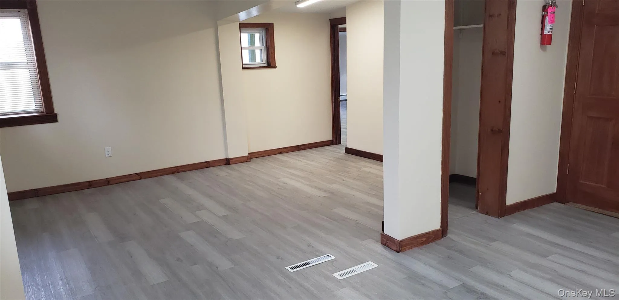 Unfurnished bedroom featuring light wood-type flooring and baseboards Unfurnished bedroom featuring light wood-type flooring and baseboards