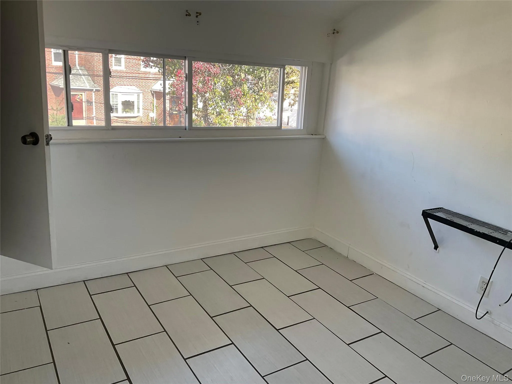 Spare room featuring baseboards Spare room featuring baseboards