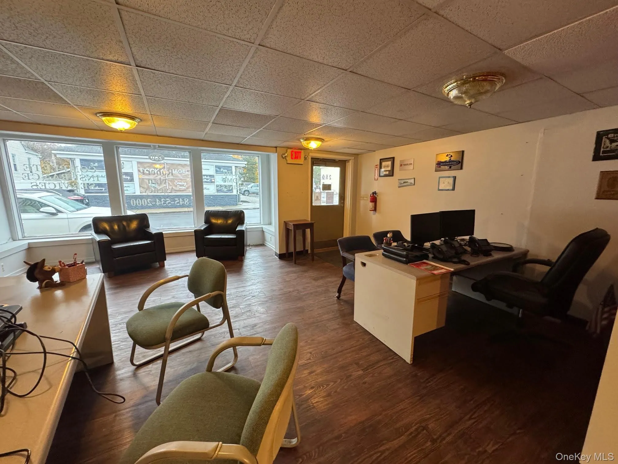 Office area with a paneled ceiling Office area with a paneled ceiling