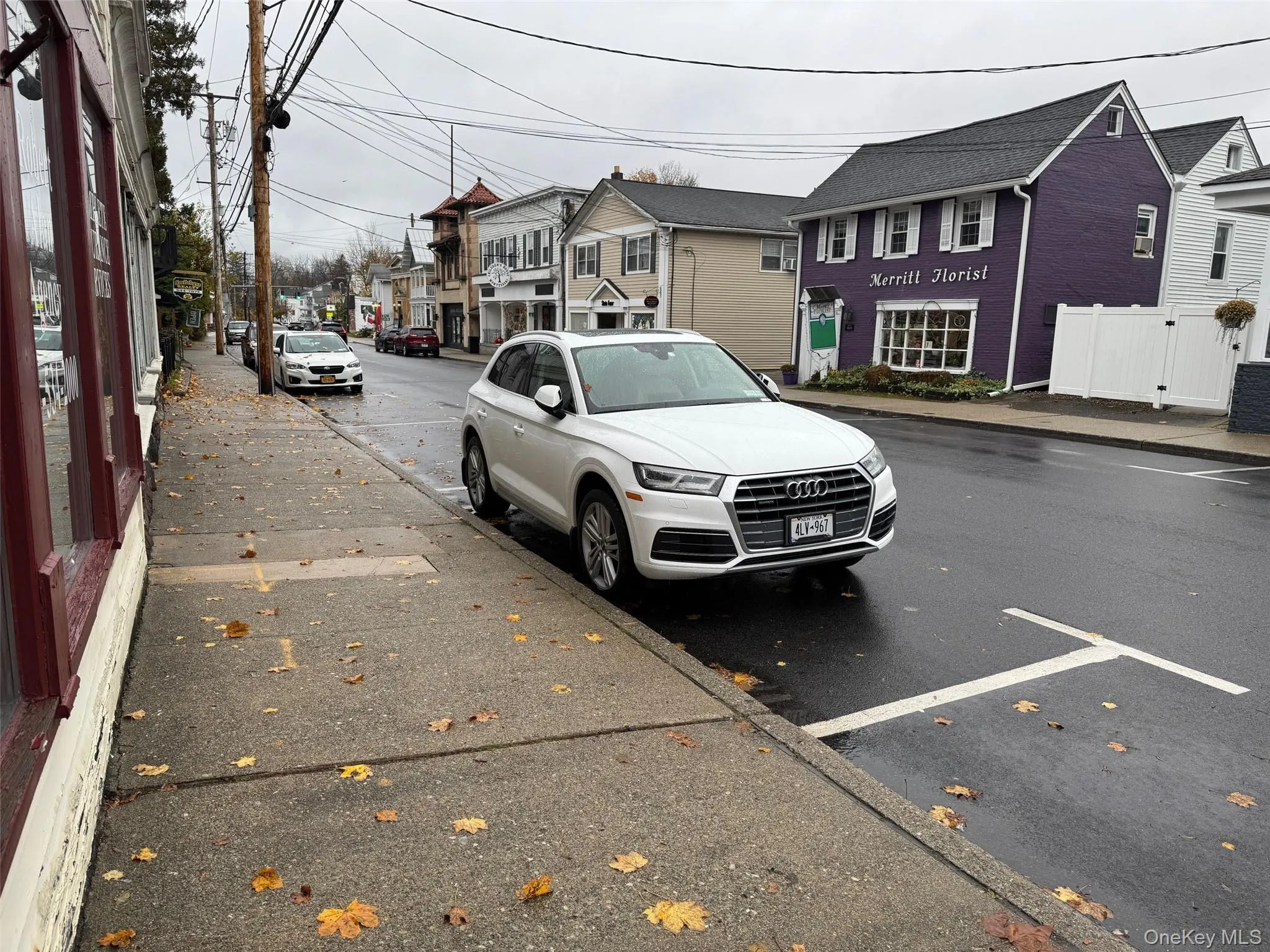 View of asphalt street featuring a residential view, sidewalks, and curbs View of asphalt street featuring a residential view, sidewalks, and curbs