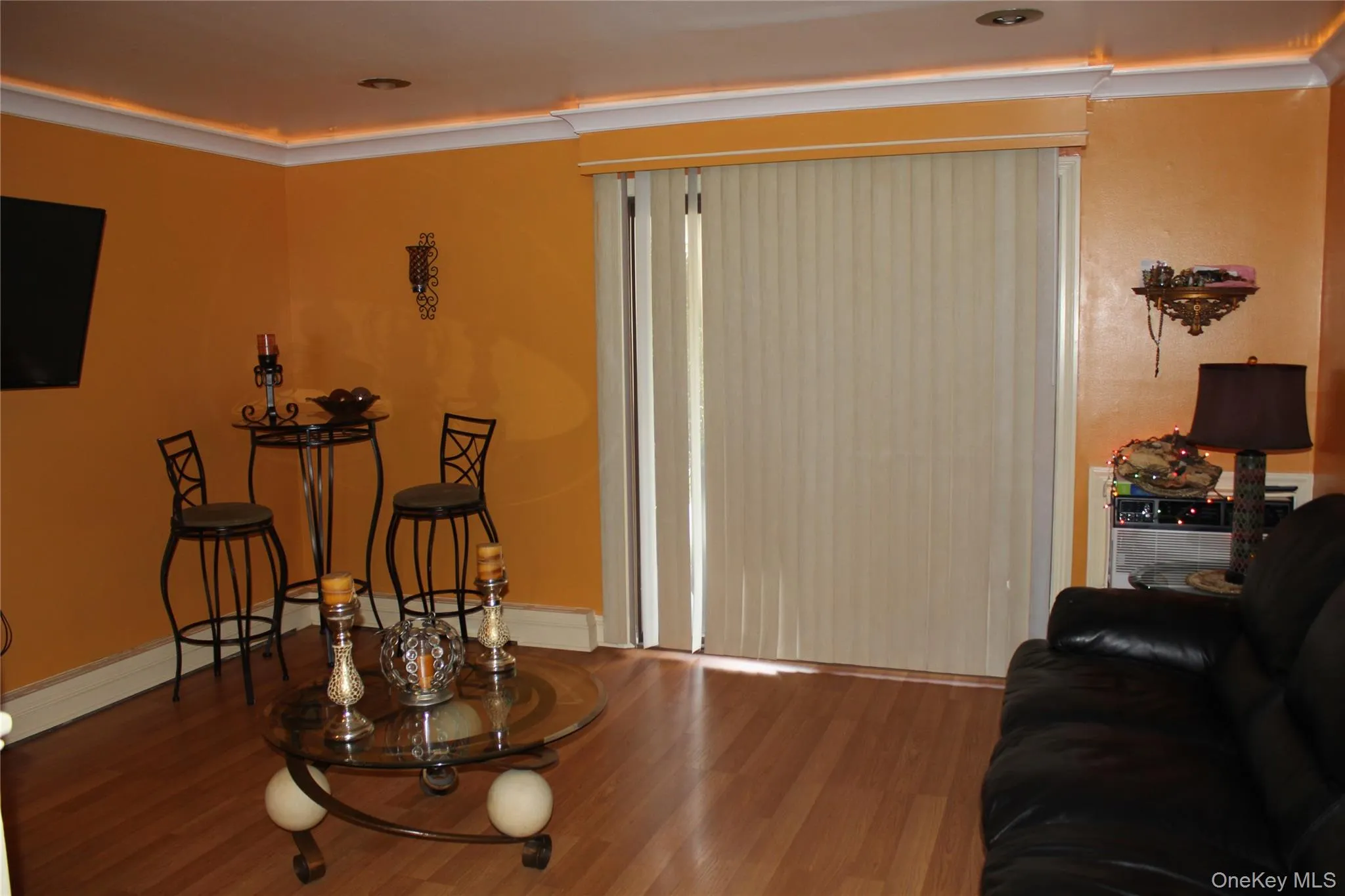 Living room featuring wood finished floors and baseboards Living room featuring wood finished floors and baseboards