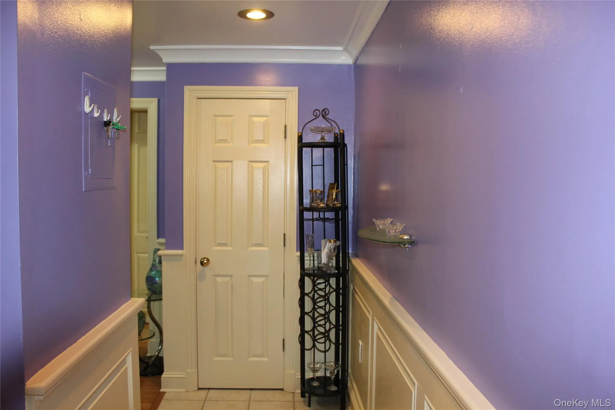 storage closet featuring crown molding, tile patterned floors, and recessed lighting storage closet featuring crown molding, tile patterned floors, and recessed lighting