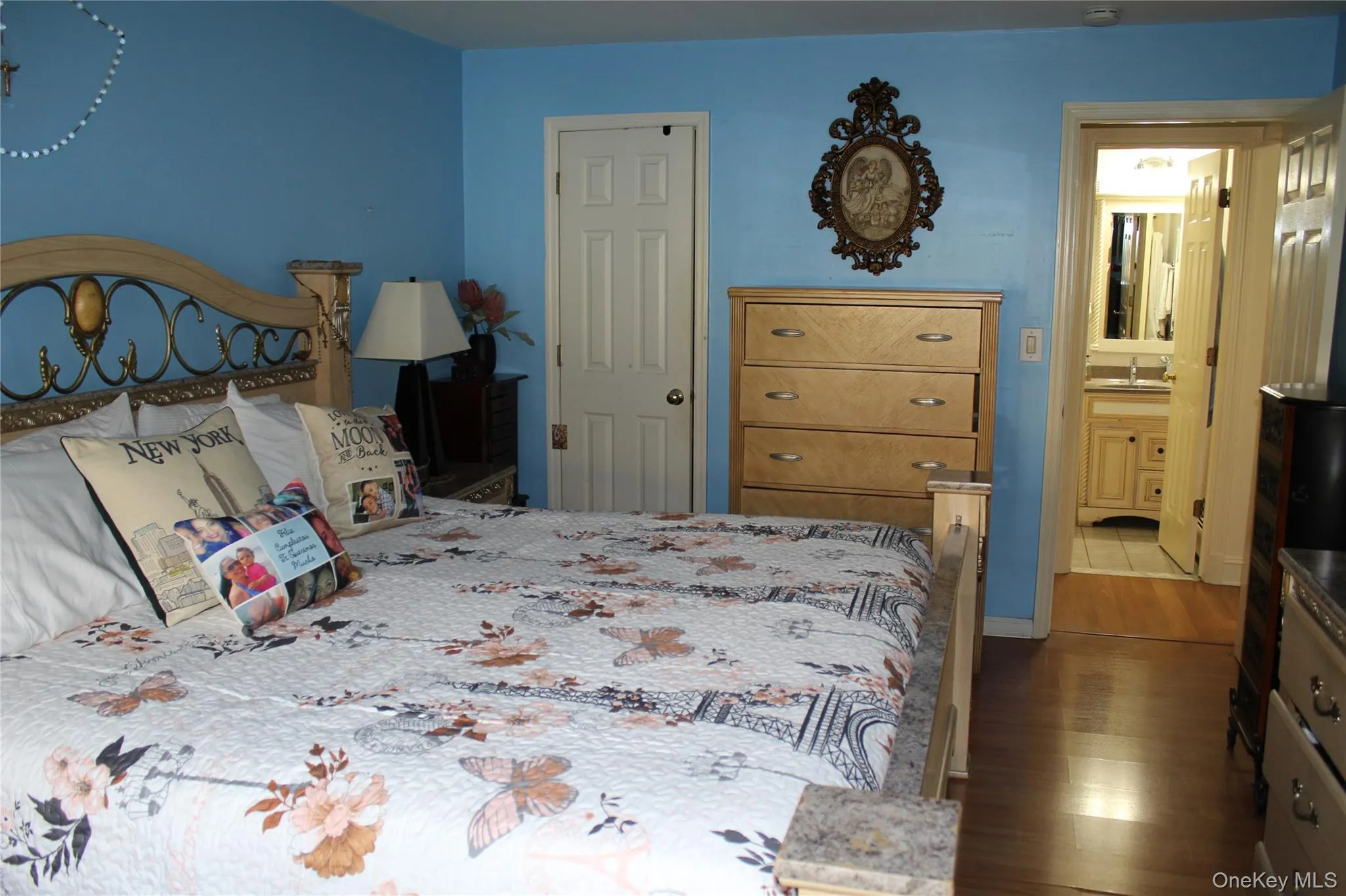 Bedroom featuring wood-style floors Bedroom featuring wood-style floors