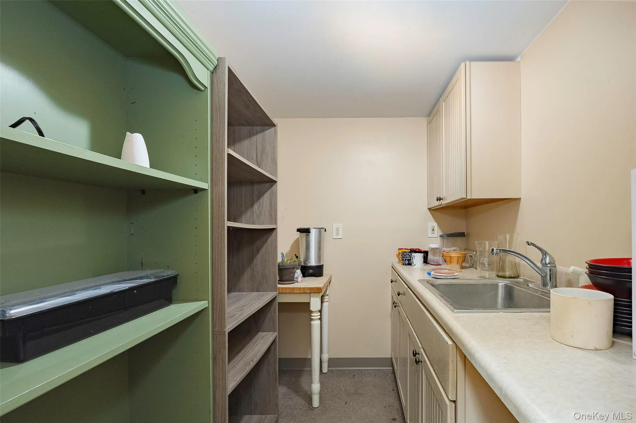 Kitchen featuring light countertops and cream cabinets Kitchen featuring light countertops and cream cabinets